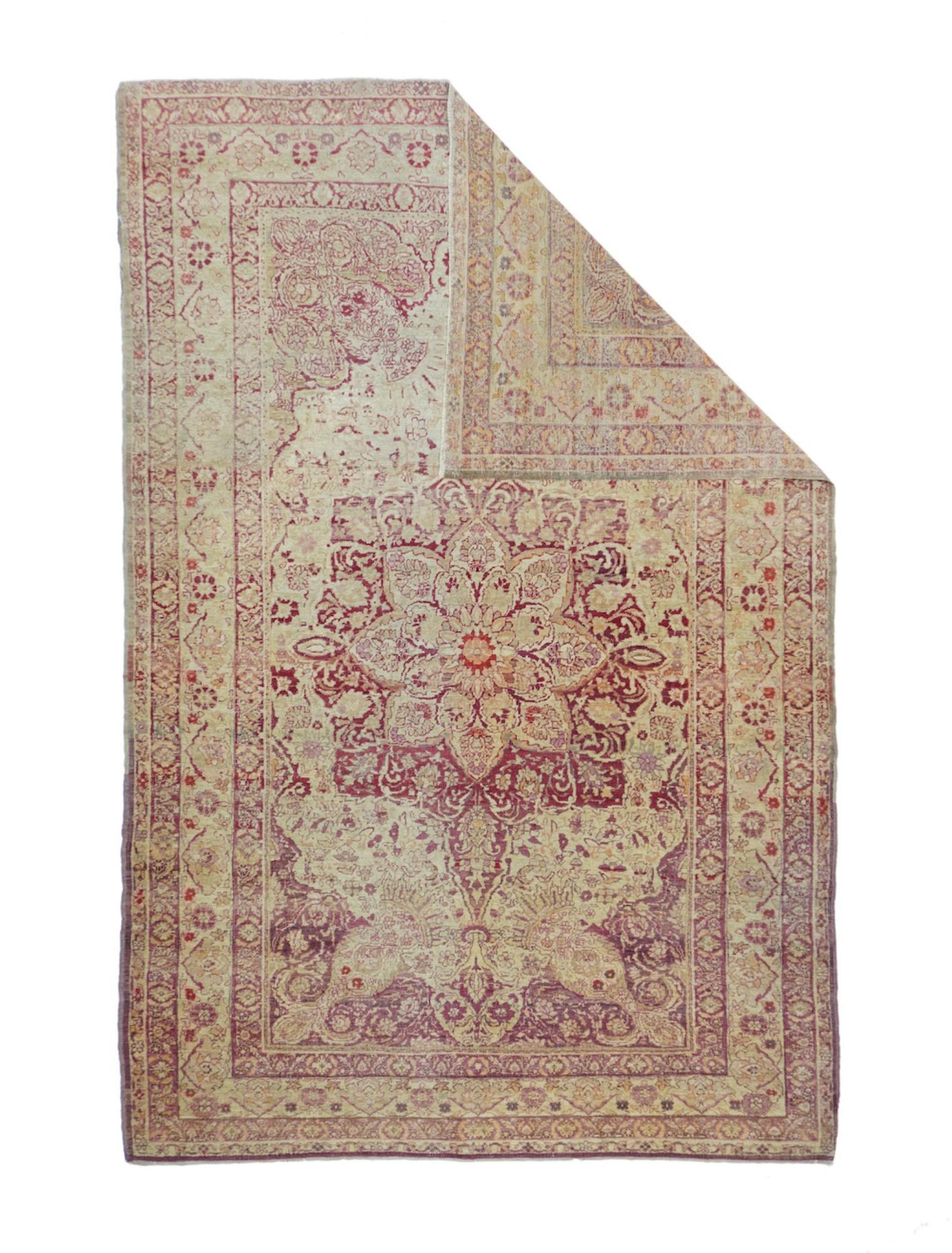 This is a characteristic, classic Kerman scatter rug with a light palette, yet a wide selection of softer naturally dyed hues. Kerman, in Southeast Iran, has almost continuously been at the rug art since about 1600, never the seat of a royal court,