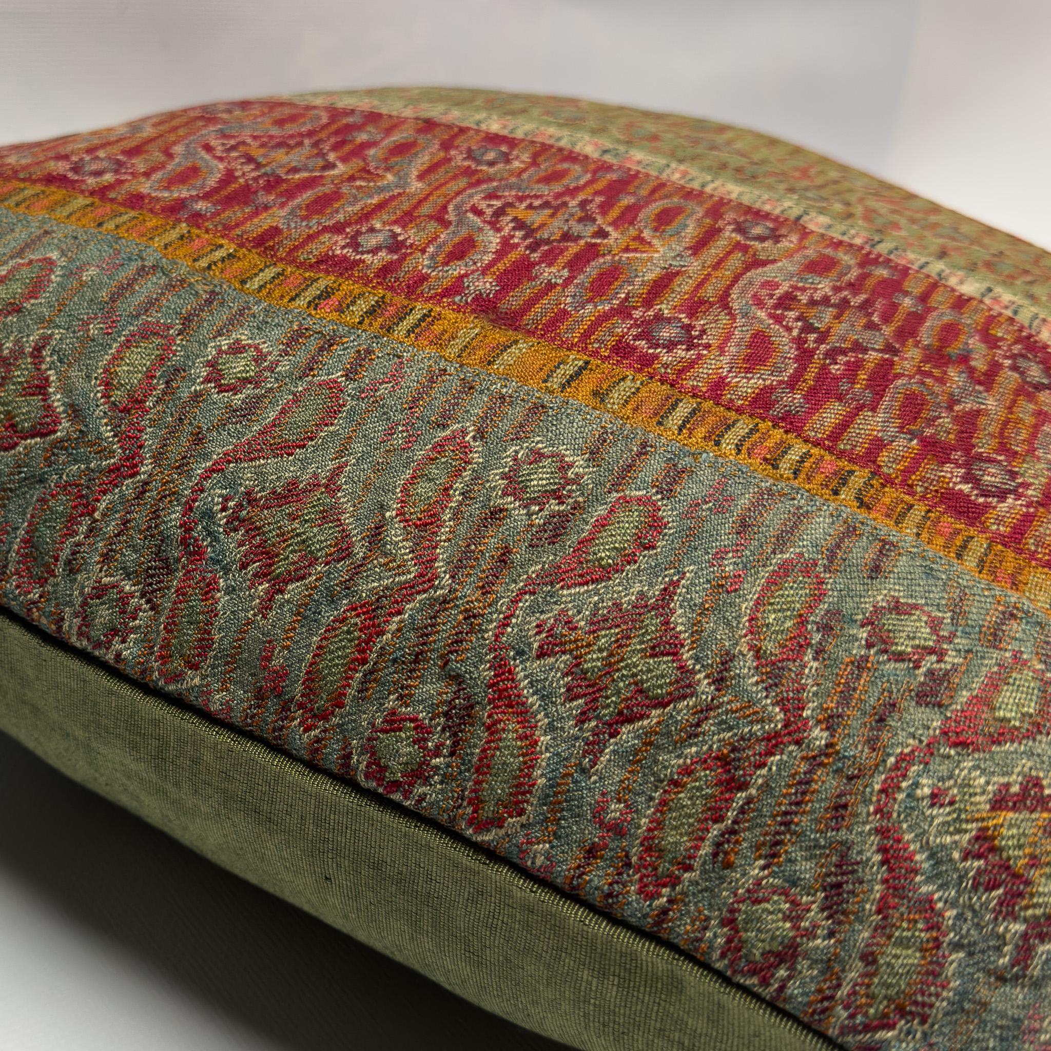 Crafted from antique handwoven wool once used as waistbands in regional women’s attire, this cover offer a rare glimpse into the sartorial traditions of Sivas, an Anatolian region of Turkey. The vertical striping in earthy reds, creams, and deep