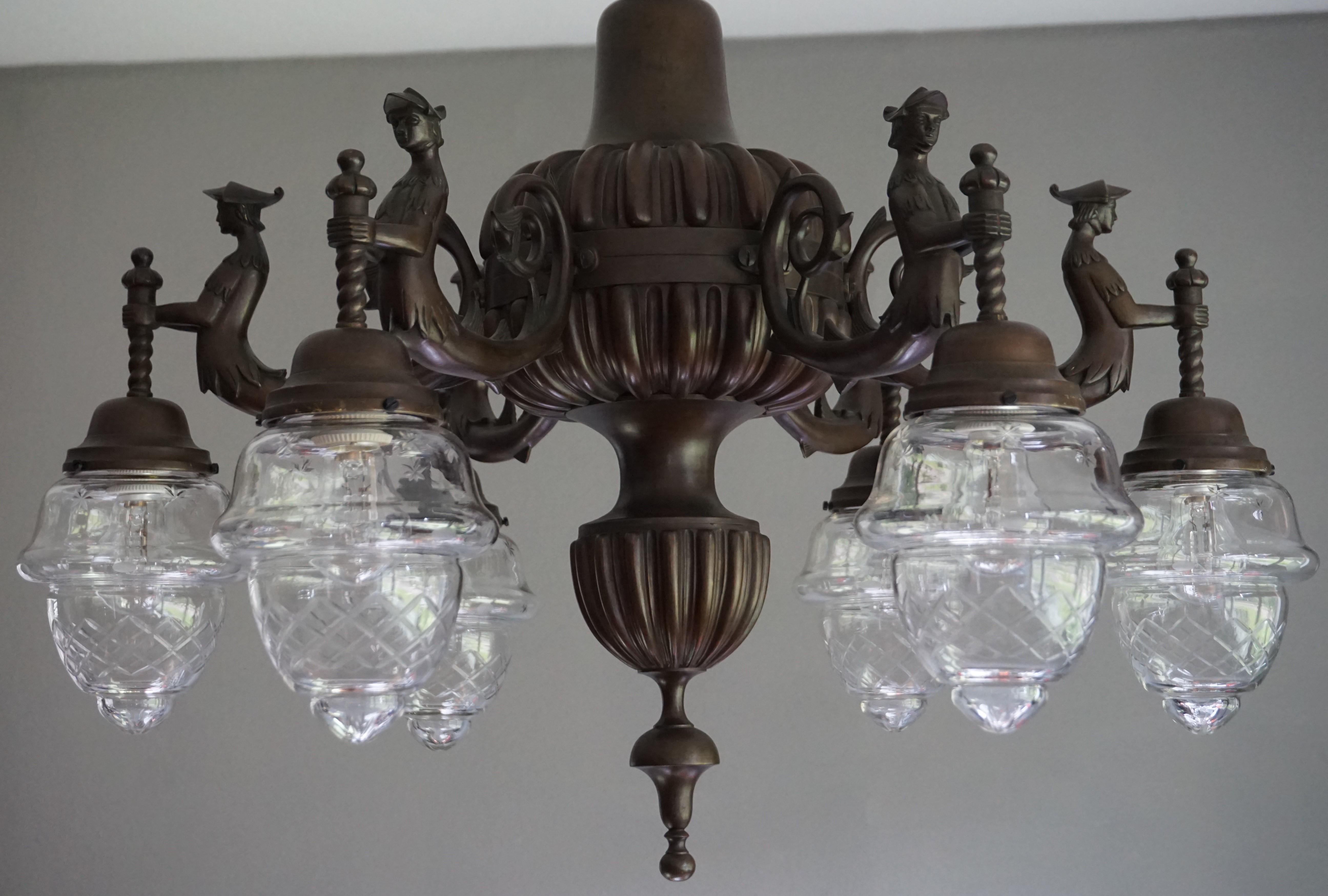 Amazing quality and excellent condition, heavy bronze chandelier.

This early 1900s and all handcrafted bronze chandelier is of amazing quality and highly decorative at the same time. We don't know the actual meaning of these templar or Robin