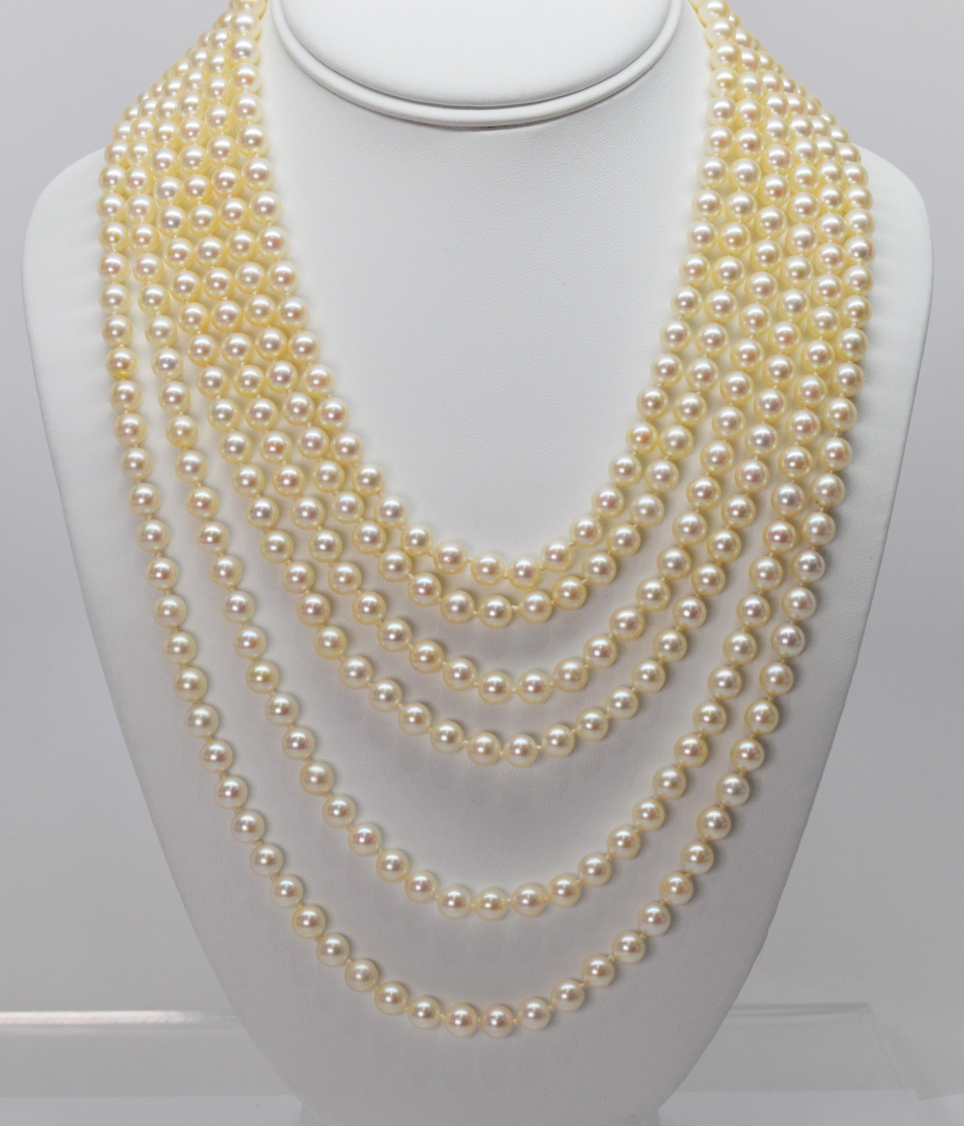 A spectacular drape of fine white AAA round Akoya Pearls adorned with a superb antique clasp of platinum, diamonds and pearls make a breathtaking statement. Close to four hundred 6-3/4 mm round pearls create this sensuous necklace by displaying six