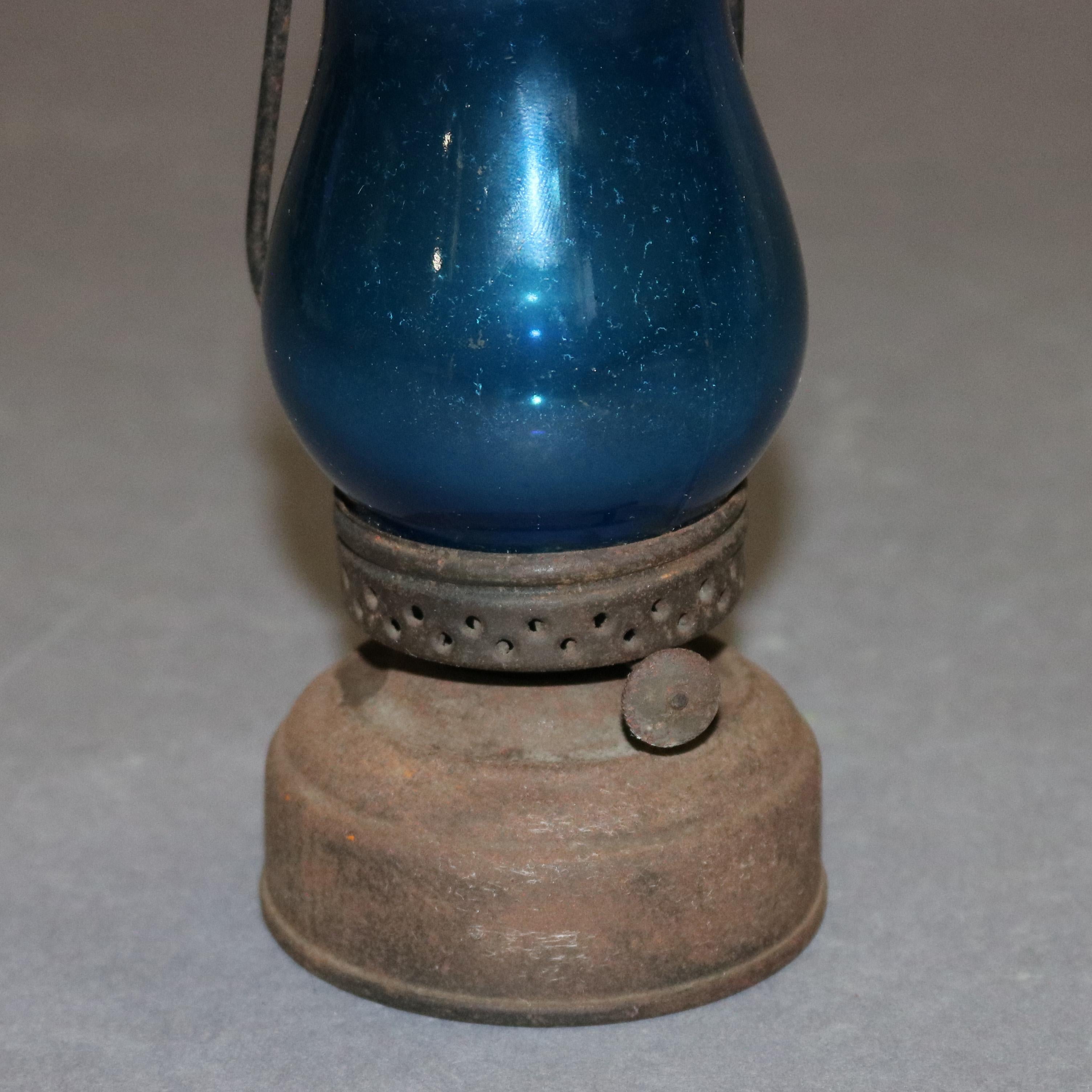 Antique kerosene skater's lamp features petite form with original blue globe, circa 1870

Measures: 7.25