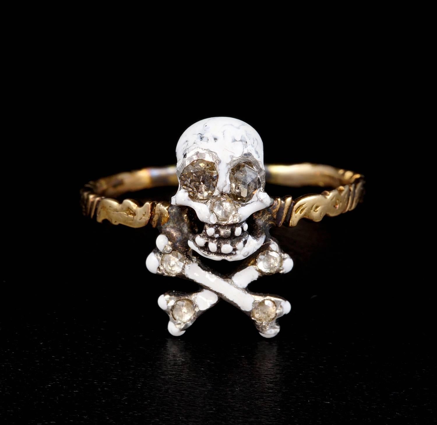 Beautiful example of authentic Georgian Memento Mori Skull ring.
Crafted of solid 16 KT and silver Tested.
Realistic skull covered by white enamelling standing on crossed bones, very delicate and impressive design enhanced by tiny rose cut