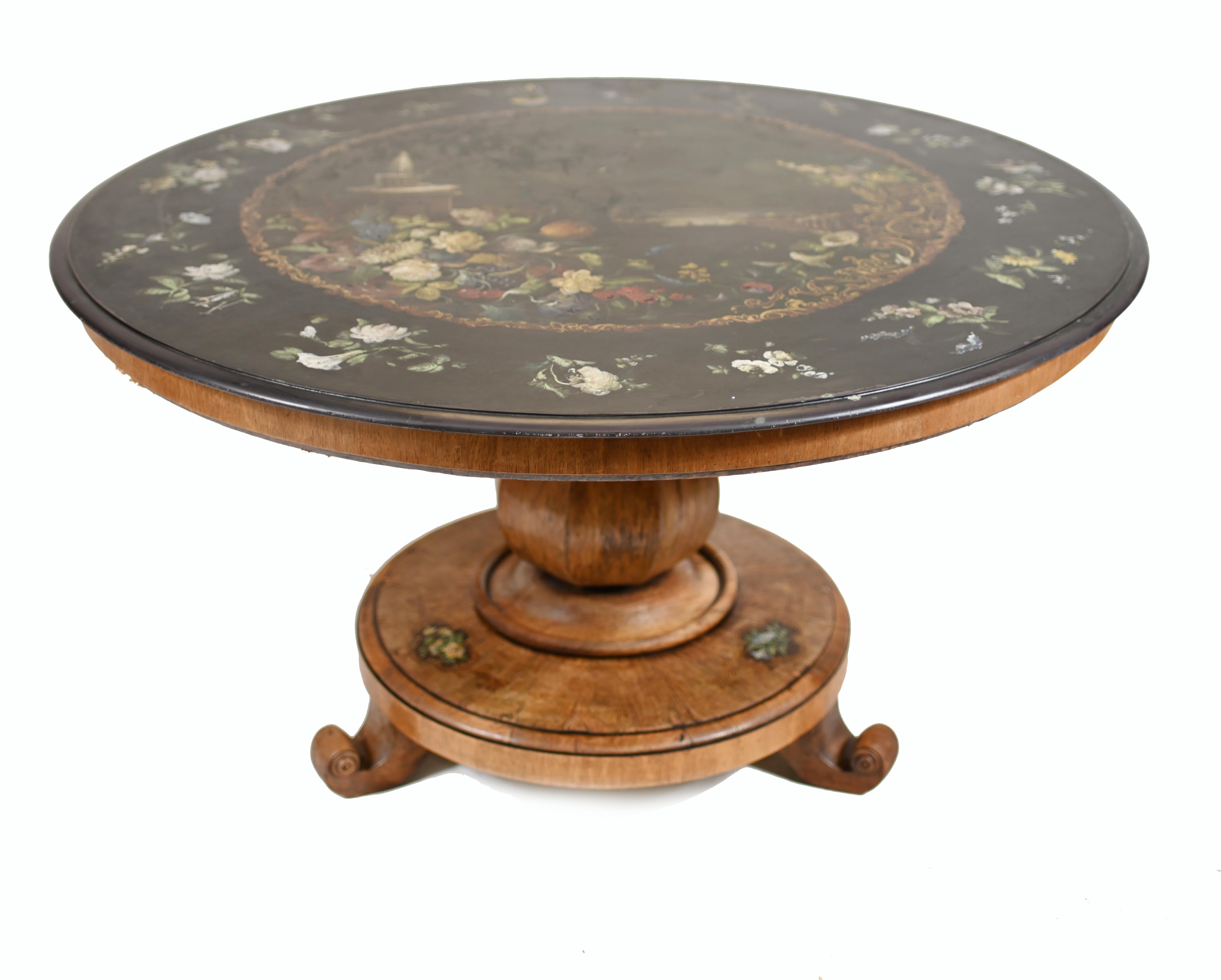 Absolutely stunning antique centre table with painted slate top.
This piece of antique folk art is Welsh in origin.
It would have been made in the Pontypool region which was famous for this type of piece.
The black slate top has been hand painted