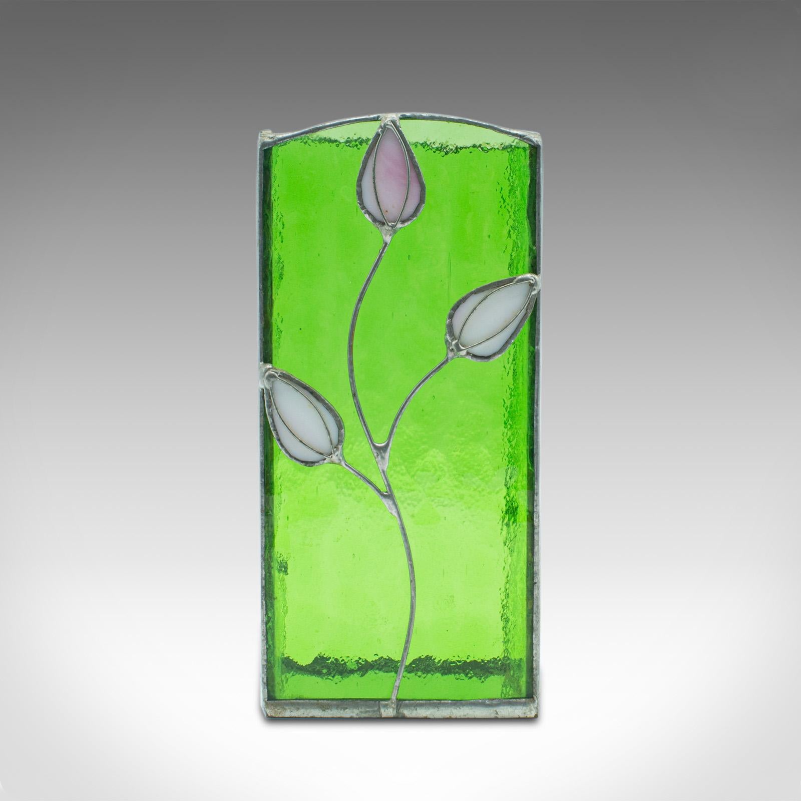 This is an antique slip vase. An English, glass and lead flower pot with Art Nouveau taste, dating to the Edwardian period, circa 1910.

Striking green glass with delightful foliate decoration.
Displays a desirable aged patina