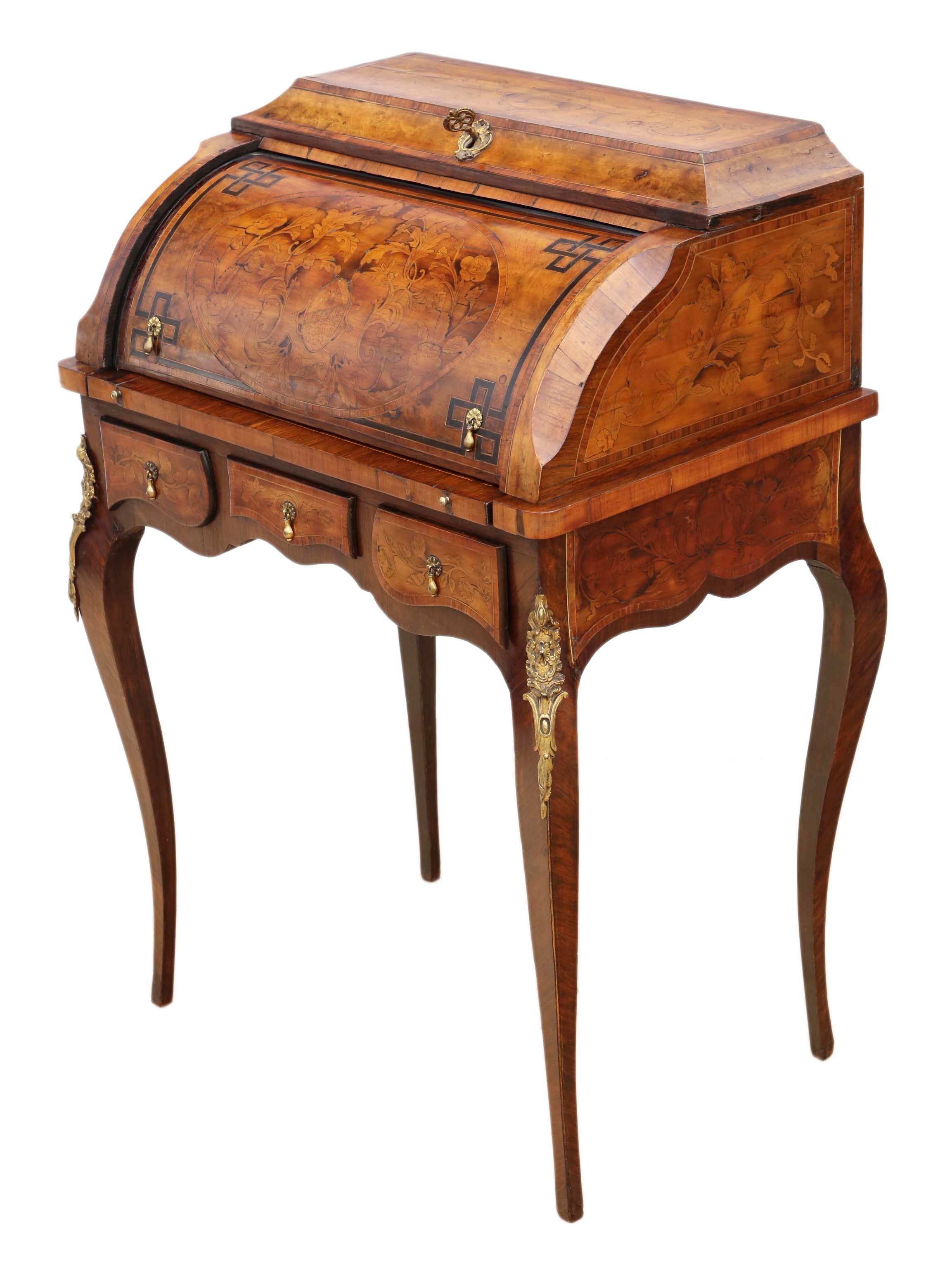 Antique quality small 19th century Marquetry cylinder bureau desk.
This is a rare breathtaking decorative piece of furniture, that is full of age, charm and character. Fantastic Marquetry veneers.
No loose joints and the oak lined drawers slide