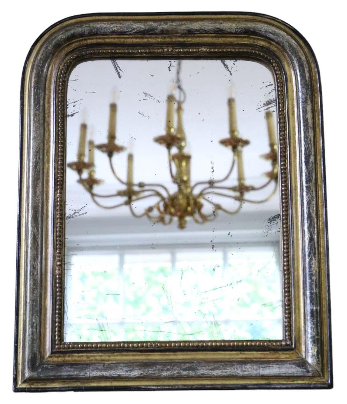 Antique small gilt overmantle wall mirror from the 19th Century, showcasing quality craftsmanship.

This mirror captivates with its modest proportions, imparting character to any suitable space. The frame boasts sturdy construction, free from loose