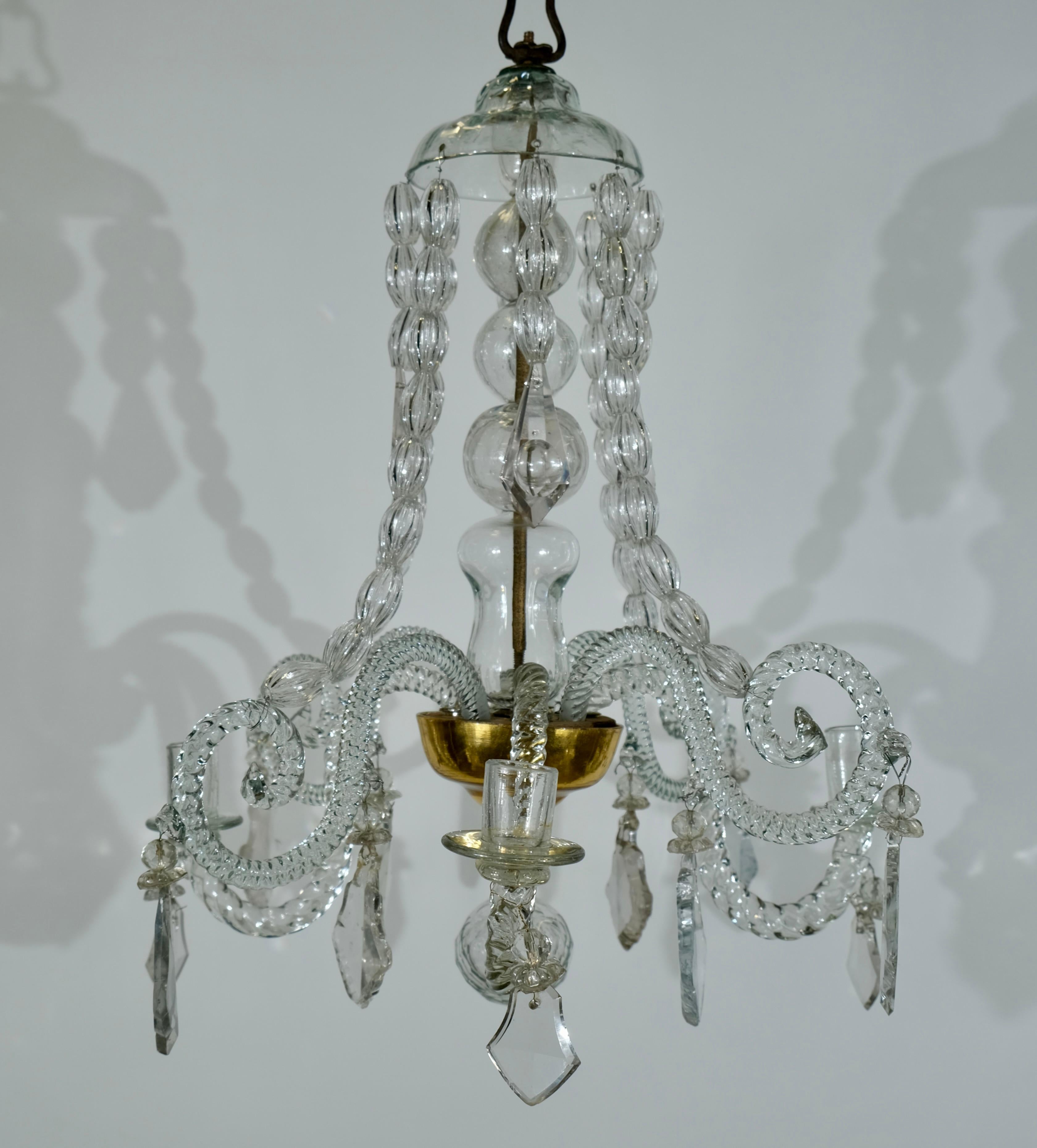 This small 4-light Bohemian crystal chandelier is a dazzling fusion of elegance and Bohemian charm, designed to infuse any space with a touch of luxury and allure. With its compact size and exquisite craftsmanship, this chandelier offers a