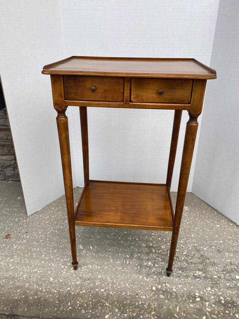 What a darling side table! Cherrywood rectangle in shape with 3/4 galleried top over 2 frieze drawers Having turned supports to a galleried lower shelf. Just the right size anywhere!