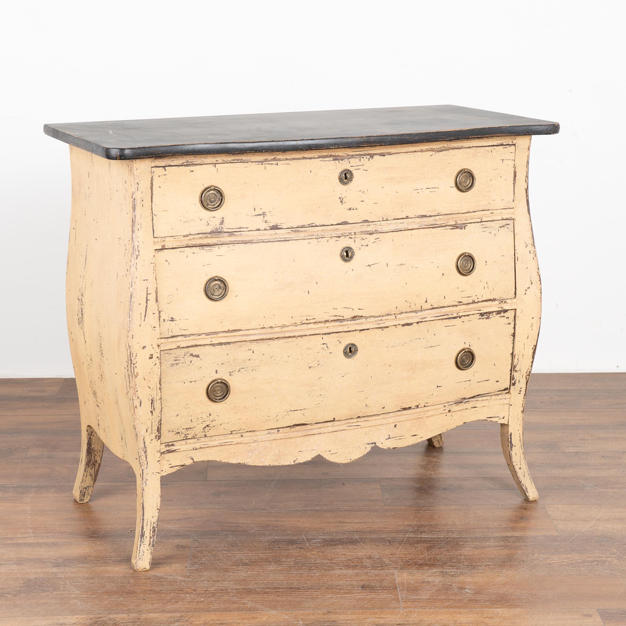 It is the slight bombay curves and feet turning gently outwards that draws one to this charming chest of drawers.
Restored, later professionally painted in layered shades of pale yellow, cream and white all lightly distressed to fit the age and