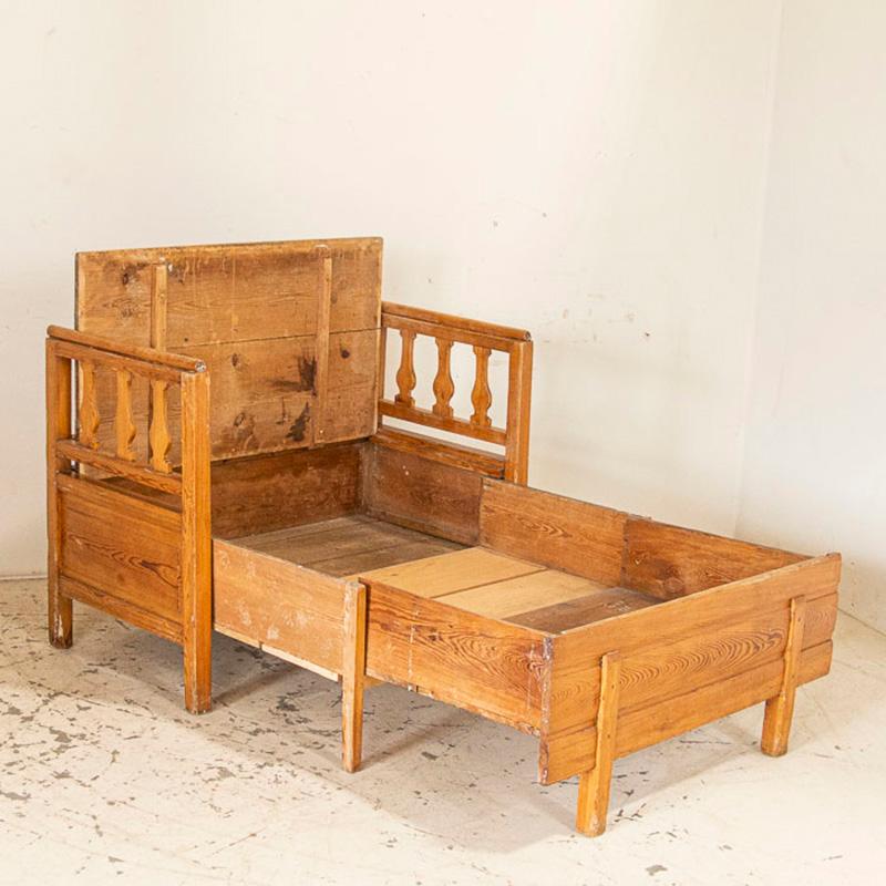 This delightful bench is a special find. The small size is unique, as most benches of the era were 5-7' long. In addition, this one was designed as a spare bed for a child. Notice how the seat lifts to reveal storage space inside? When extended, the