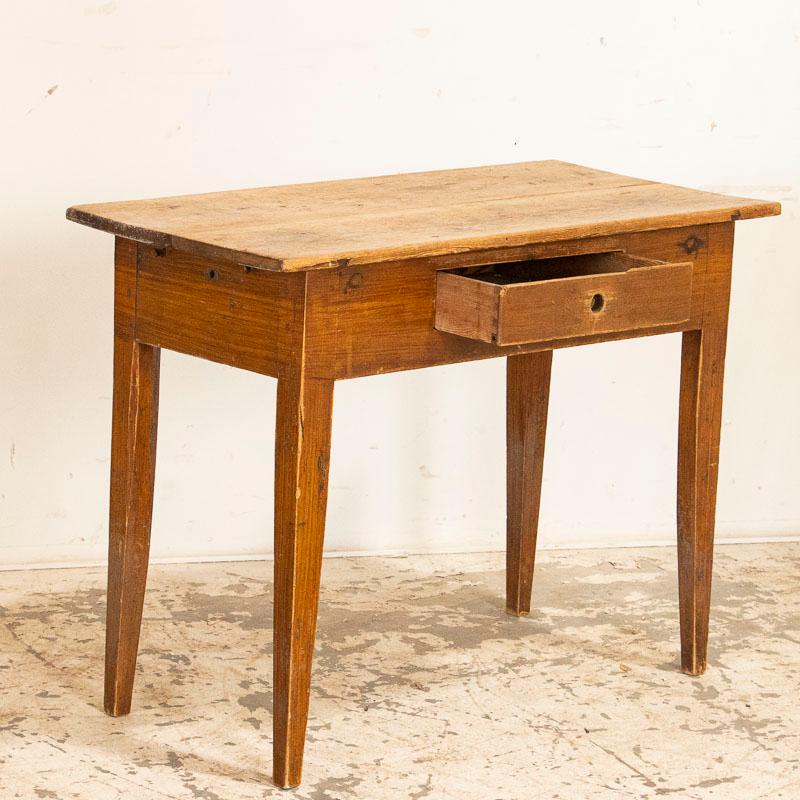Sometimes it is the most simple things that bring the greatest joy. The natual pine of this small side table has aged wonderfully, and bears a warm patina after constant use that likely came from a farmhouse in the Swedish countryside. Gently