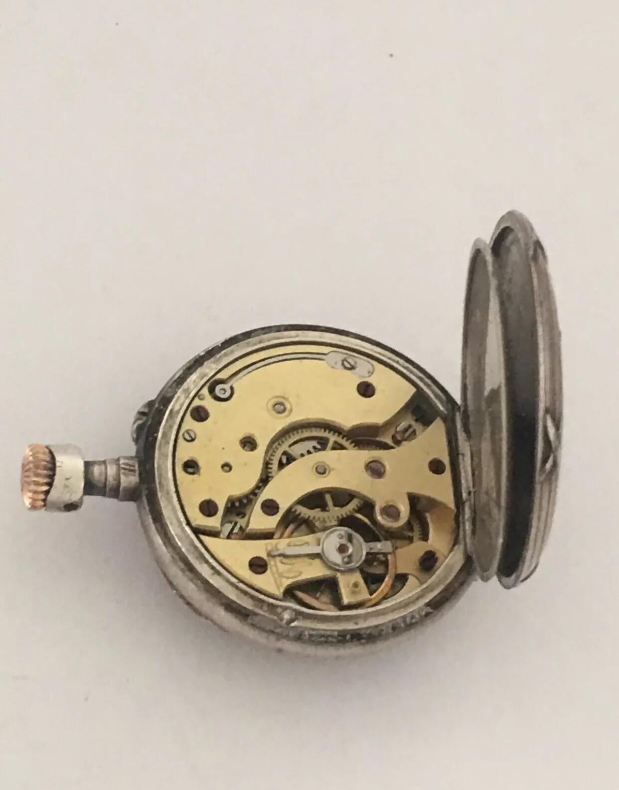 small silver pocket watch
