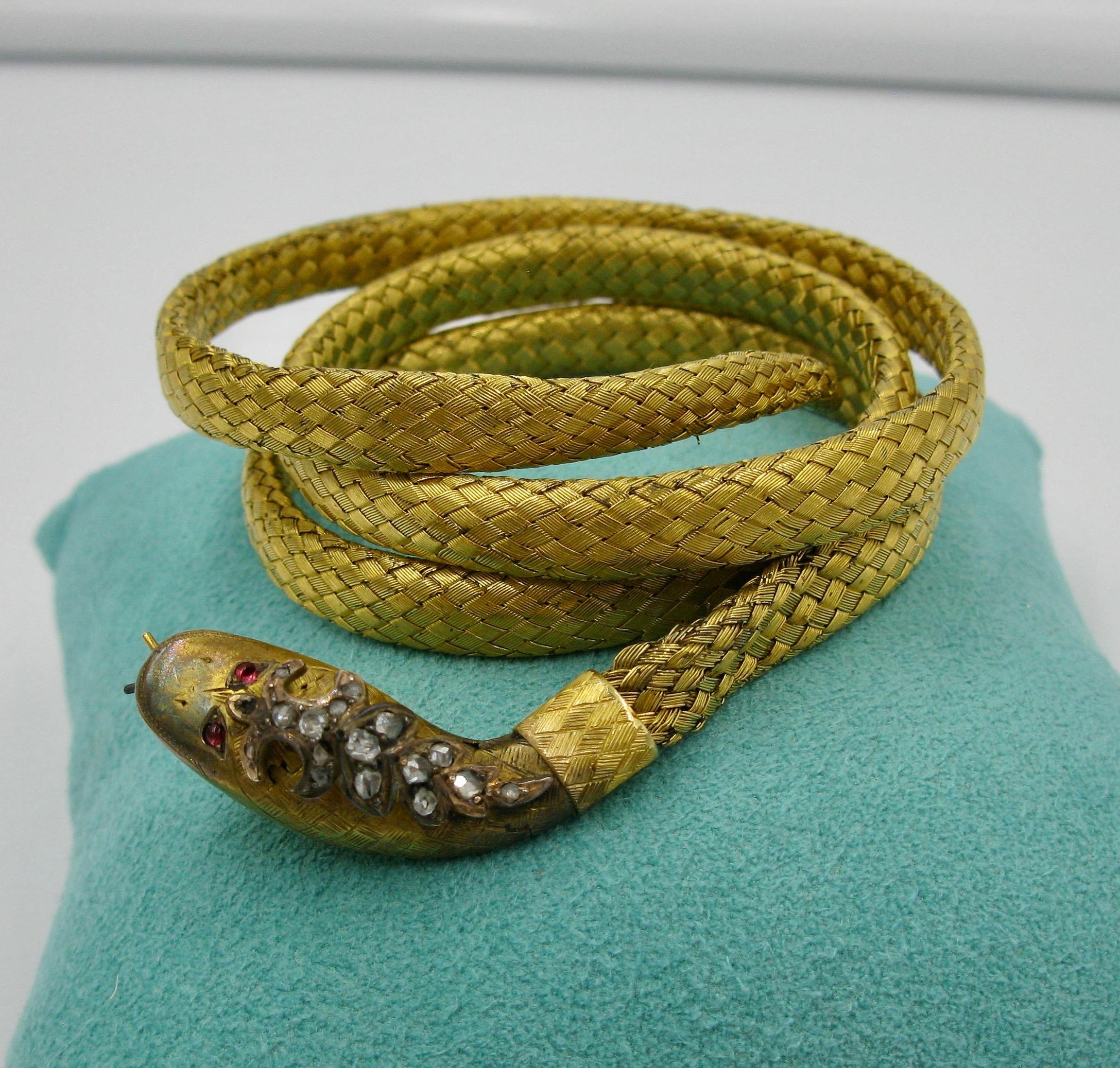 gold snake bracelet with ruby eyes