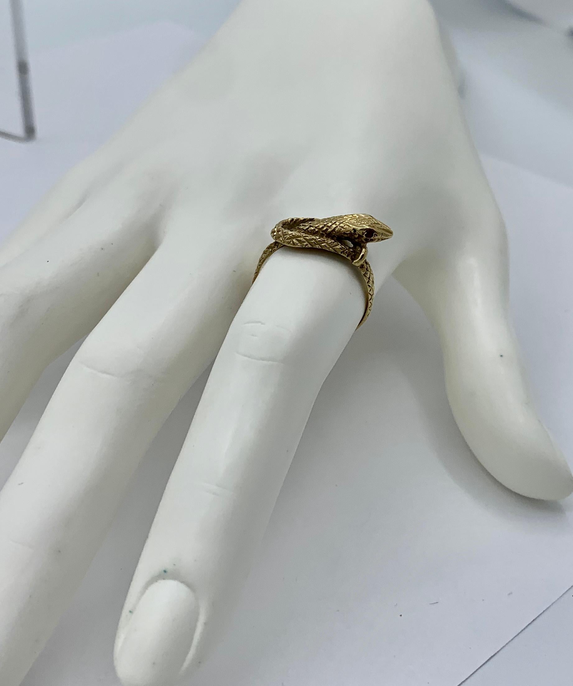 gold snake ring with ruby eyes meaning