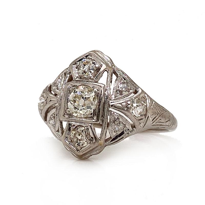 Antique Solid 20K White Gold Genuine Diamond Filigree Ring 1.15CTTW 3.8g
Excellent condition. This antique ring made of solid 20K white gold holds a genuine yellow old mine cut diamond that weighs approximately 0.85ct. Next to it is a genuine white