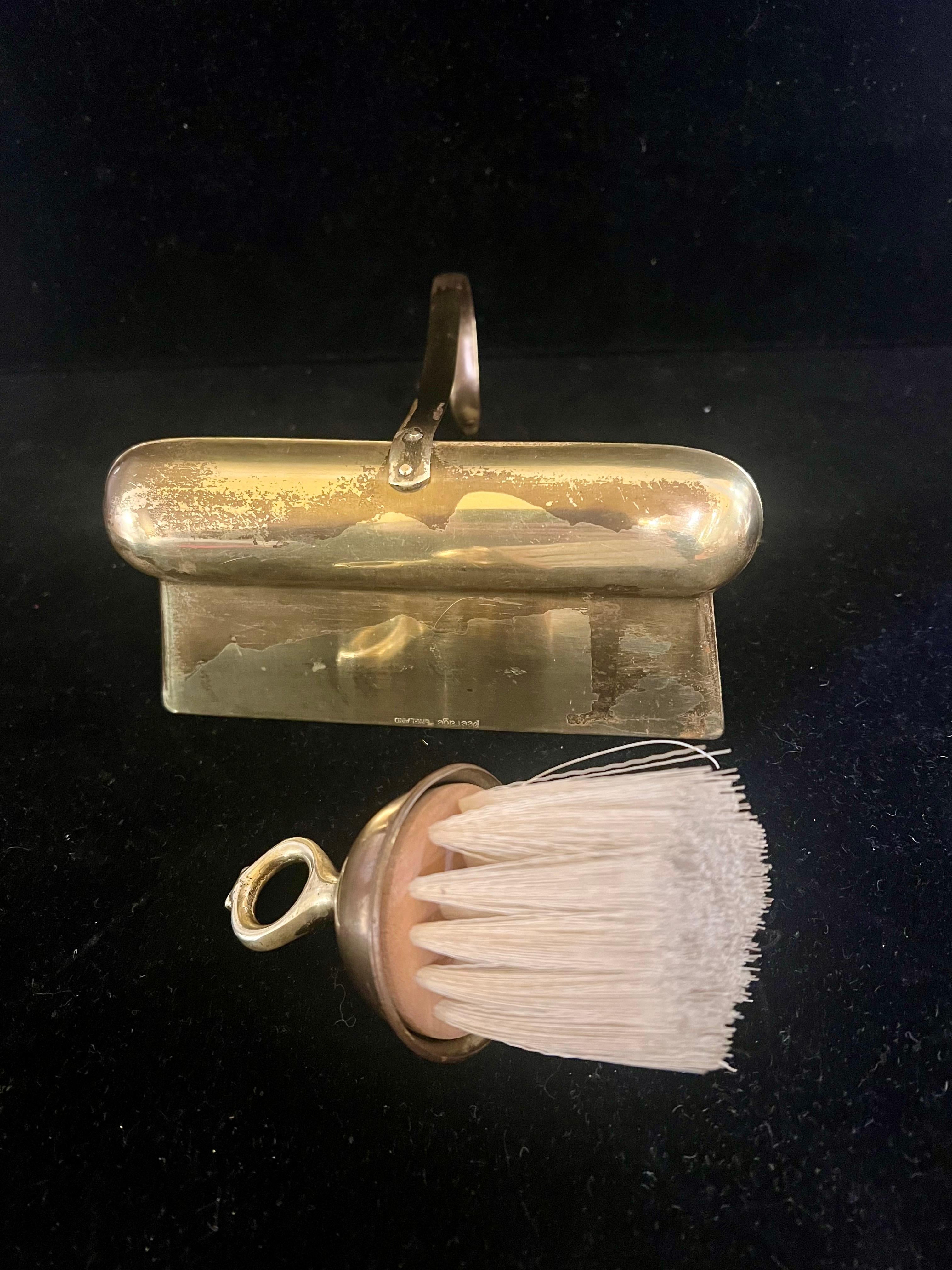 brass dustpan and brush