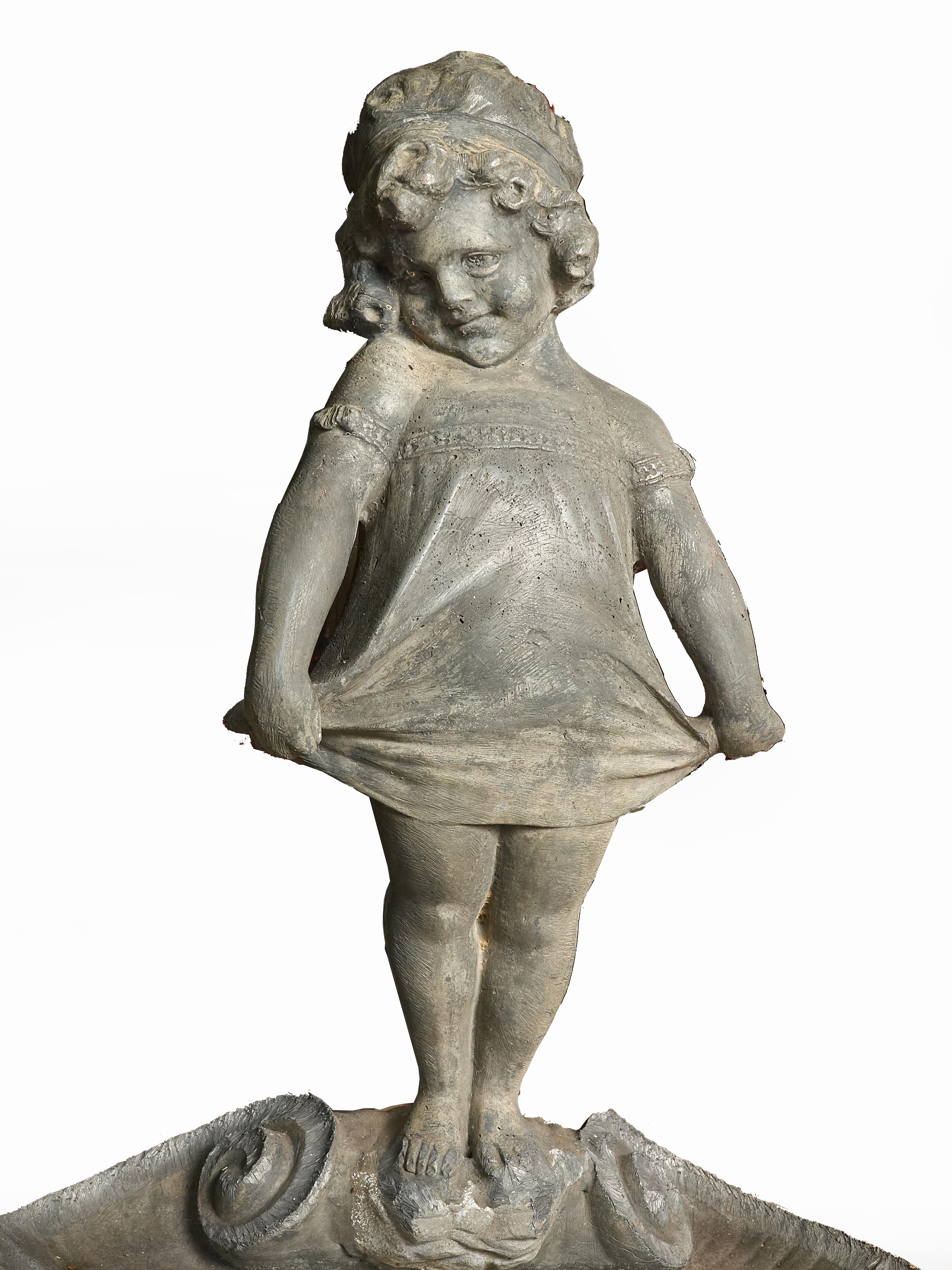 Charming early 20th century fountain of a young girl standing on a scallop shell curtsying to a frog who sits at the shell's edge. The fountain source is the frog's mouth. The fountain is solid lead and in excellent condition.
The child is done