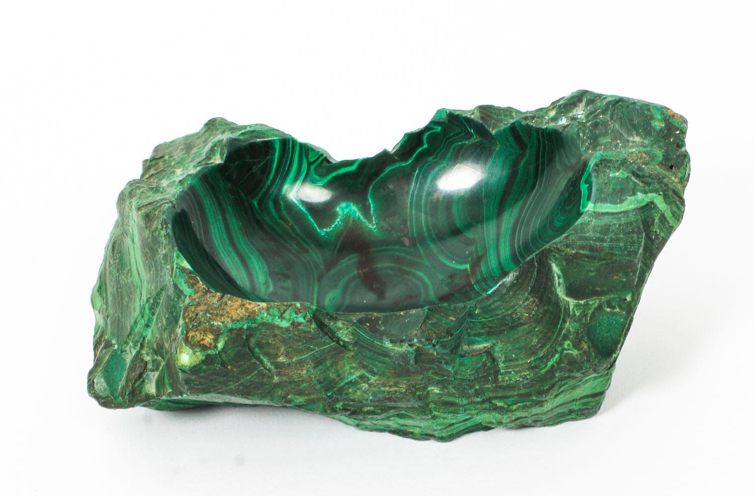 This is a beautiful antique solid malachite specimen trinket dish, early 20th Century in date.

Made from solid malachite in a naturalistic form with a hollowed and polished central dish.

Add an elegant touch to your home with this lovely and