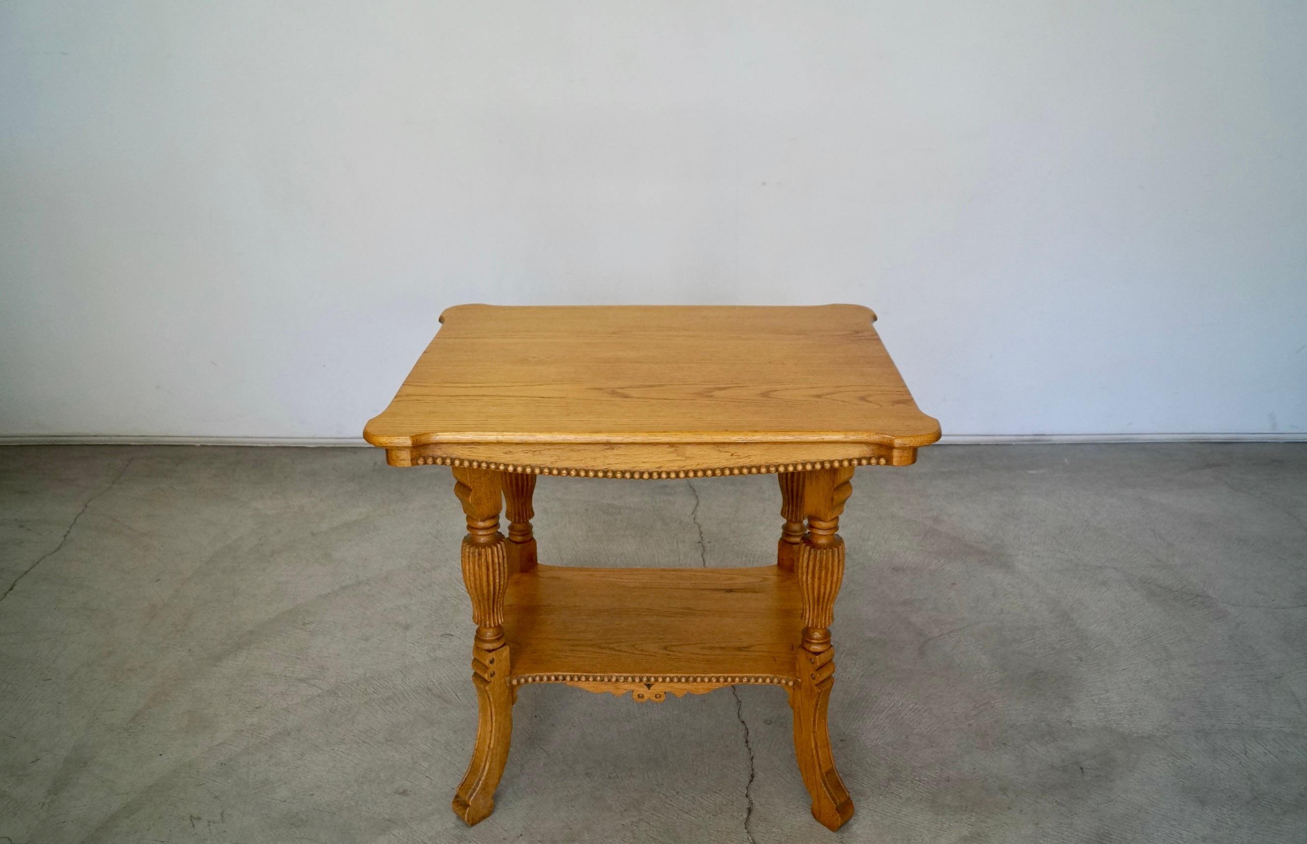 ntique end table for sale. From the late 1800's / early 1900's. Made of solid oak with incredible wood work and detail. This was previously refinished in a natural oak finish. It's a beautiful accent table with great construction. It has a shelf