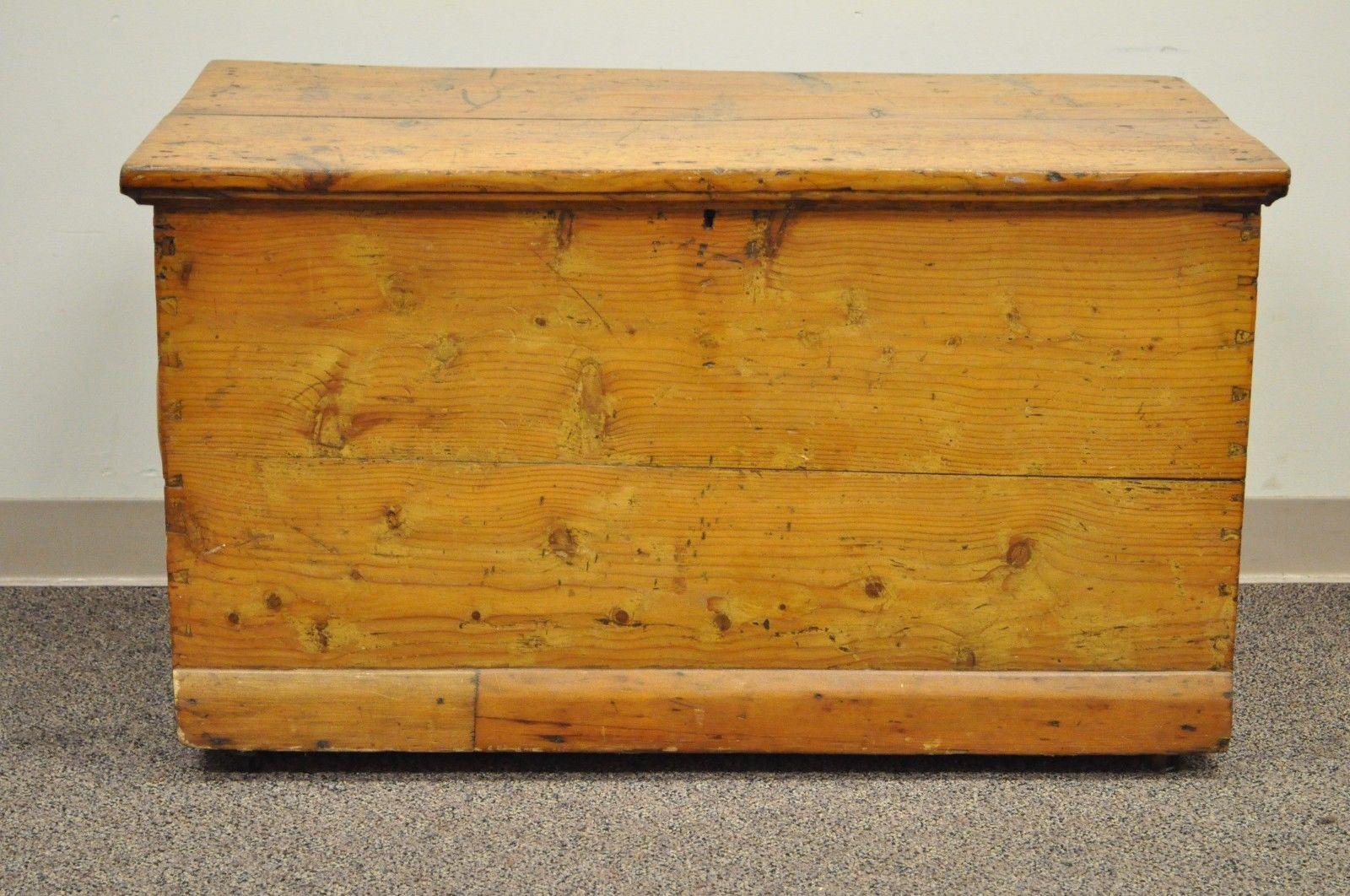 Antique solid pine hand dovetailed American primitive blanket chest. Item details hand dovetailed joinery, solid wood construction, exposed joint construction to wood plank top, blue painted interior, great original patina, American made, circa