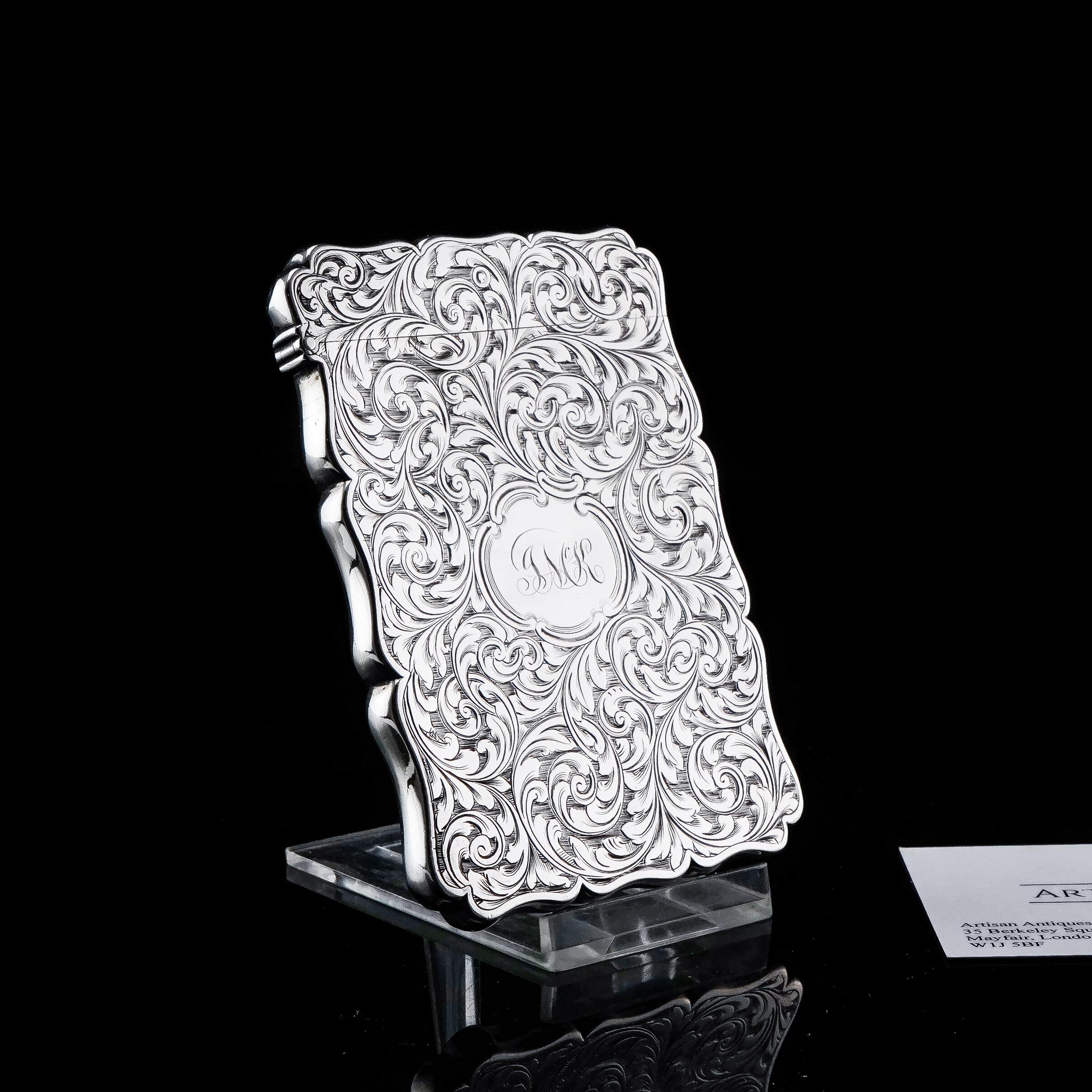 We are delighted to offer this fabulous solid silver card case made by Edward Smith in Birmingham, 1862.
 
This card case is a fine example of fine Victorian craftsmanship and hand engraving. The case has been fully embellished on the exterior with