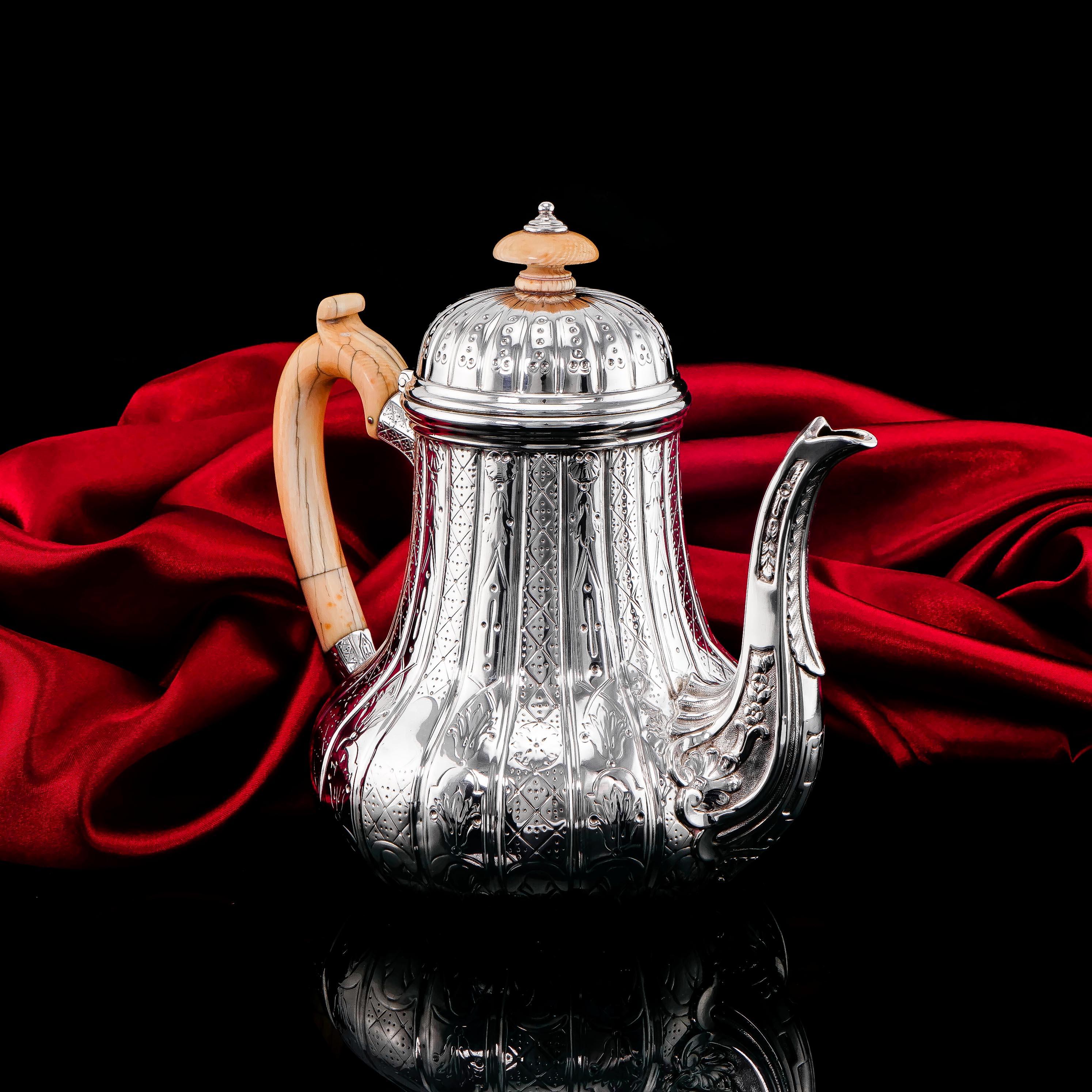 We are delighted to offer this elegant antique solid silver Victorian coffee pot made in London in 1866 with the marks of Robert Garrard. 
 
Garrard (founded in 1735), still producing fine silverware and jewellery today, throughout history has been