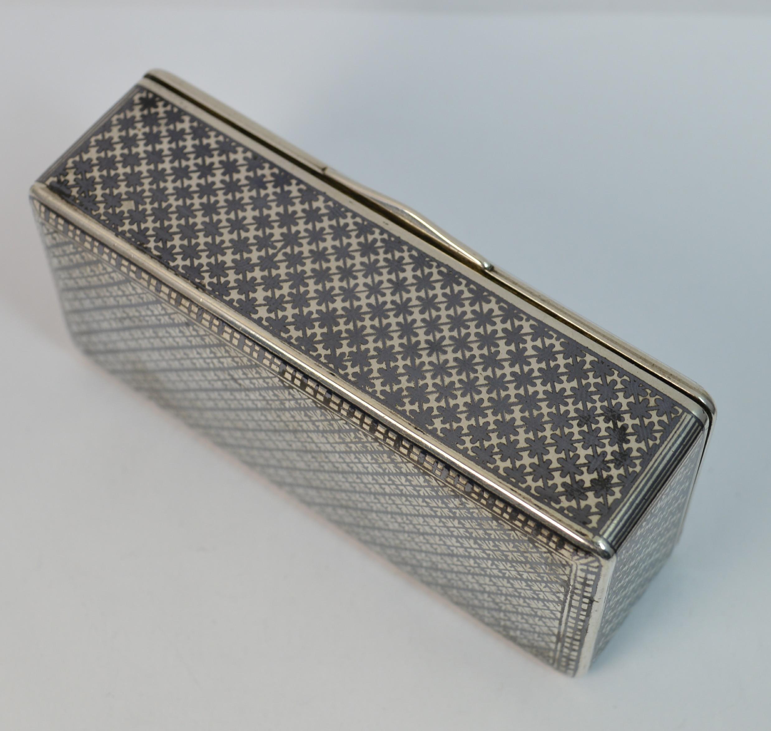 
A beautiful solid silver box.

Stylish design with fine niello enamel to every side including base, great quality.

Fine rose gold plate or gilt insides.


Hallmarks ; marks to inside of lid and base, 84 grade
Weight ; 101 grams 
Size ; 8.2cm x