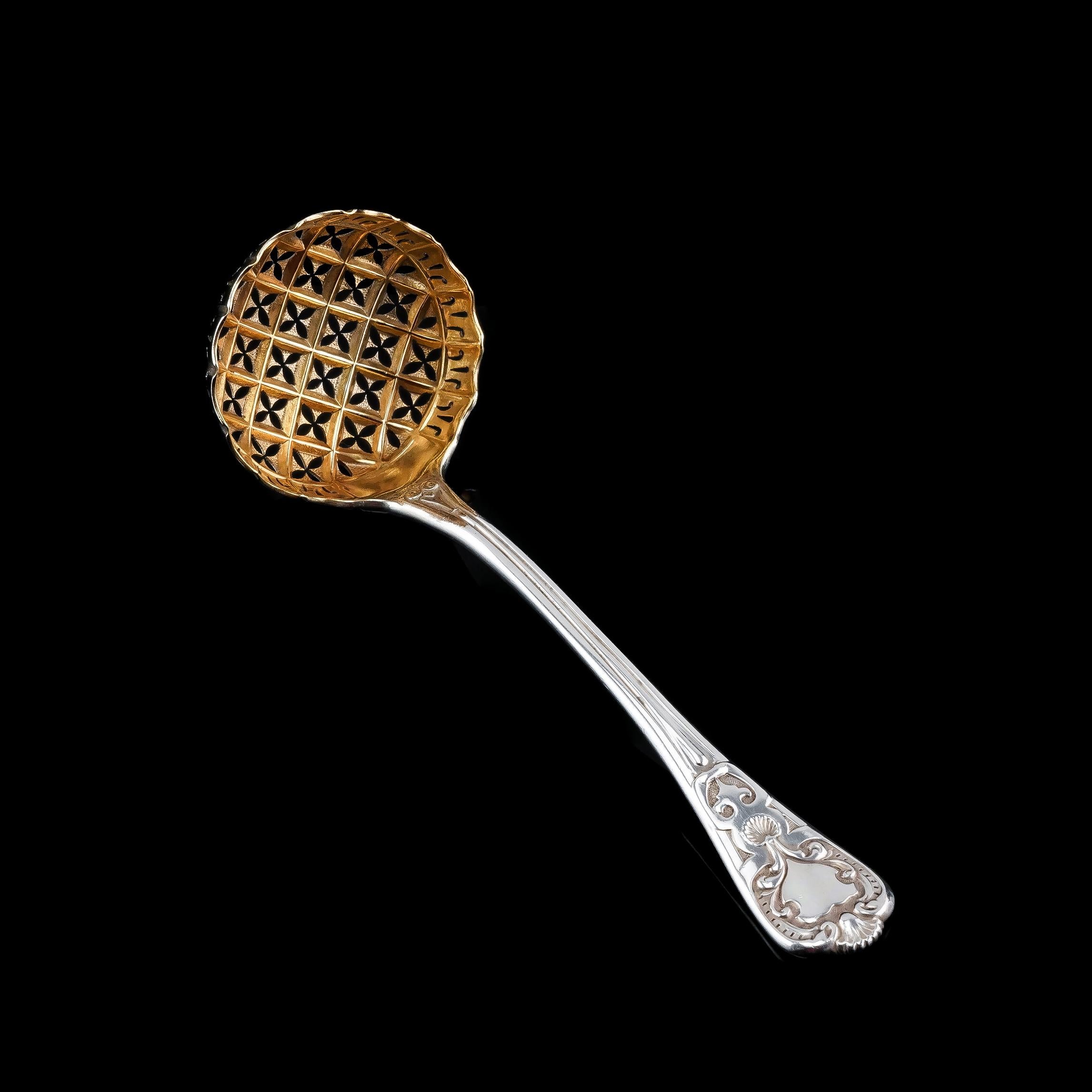 We are delighted to offer this quality Victorian solid silver sugar sifter spoon made in London in 1856 by Francis Higgins.
 
As to be expected with Higgins' fine flatware, this spoon is of no exception featuring an array of highly desirable and