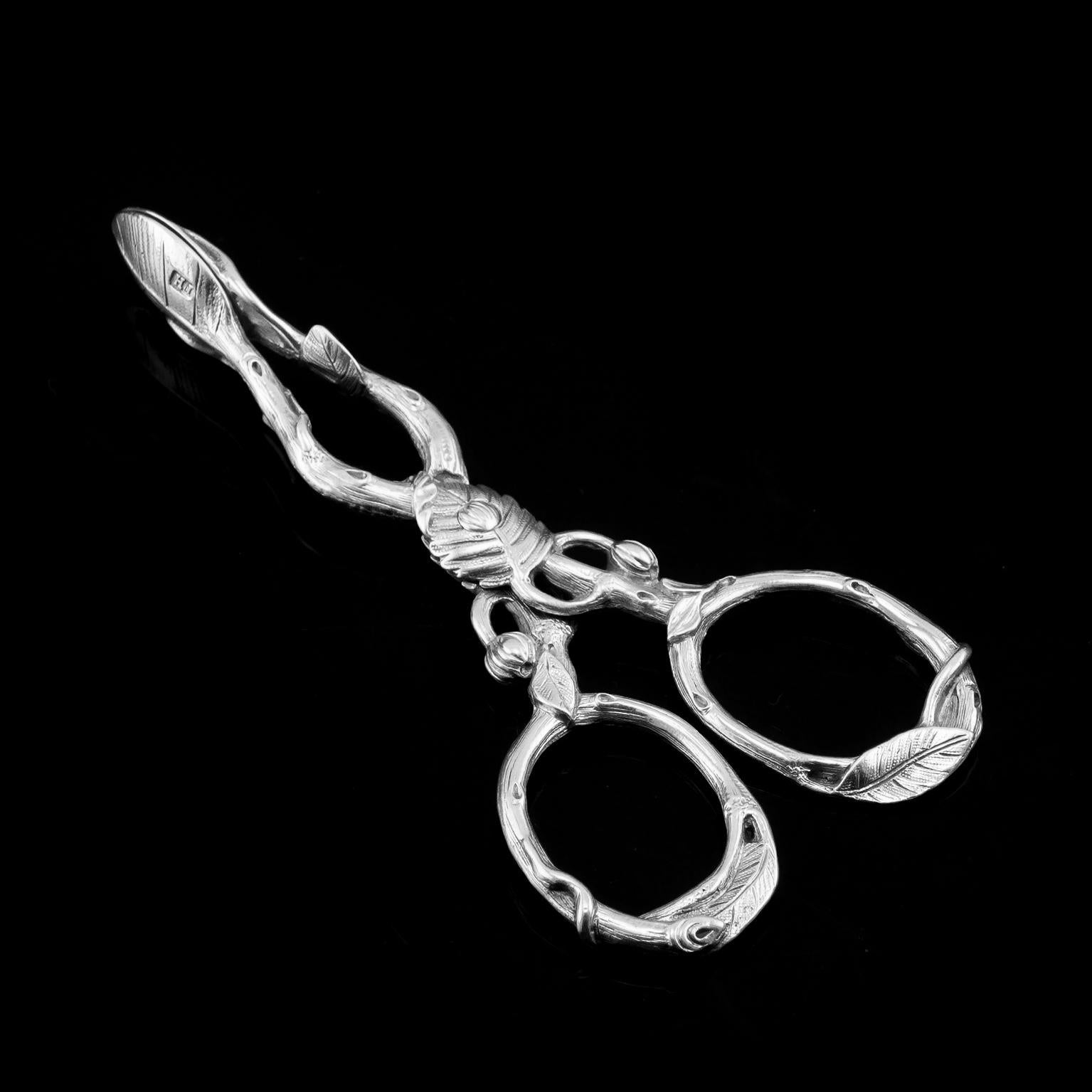 We are delighted to offer this stunning example of Victorian solid silver sugar tongs/nips made by a fine maker; Francis Higgins in London 1859.
 
The tongs are decorated with the naturalistic foliate theme throughout with an impressive amount of