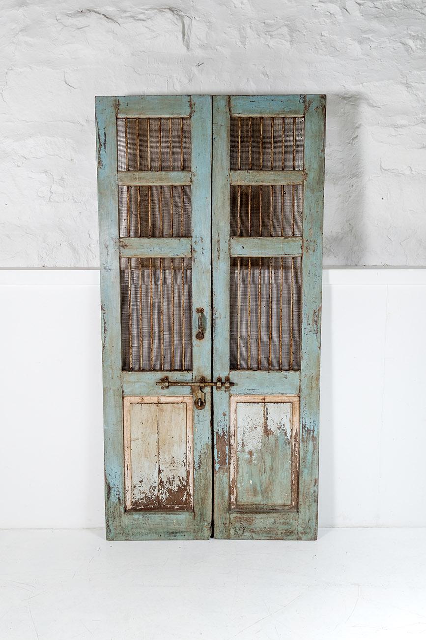 A very solid, high quality pair of hardwood 19th Century French shutter doors in original paint. A superb looking pair of doors with original ironmongery, including meshed upper section with iron bars.
The doors do not have any glazing so these