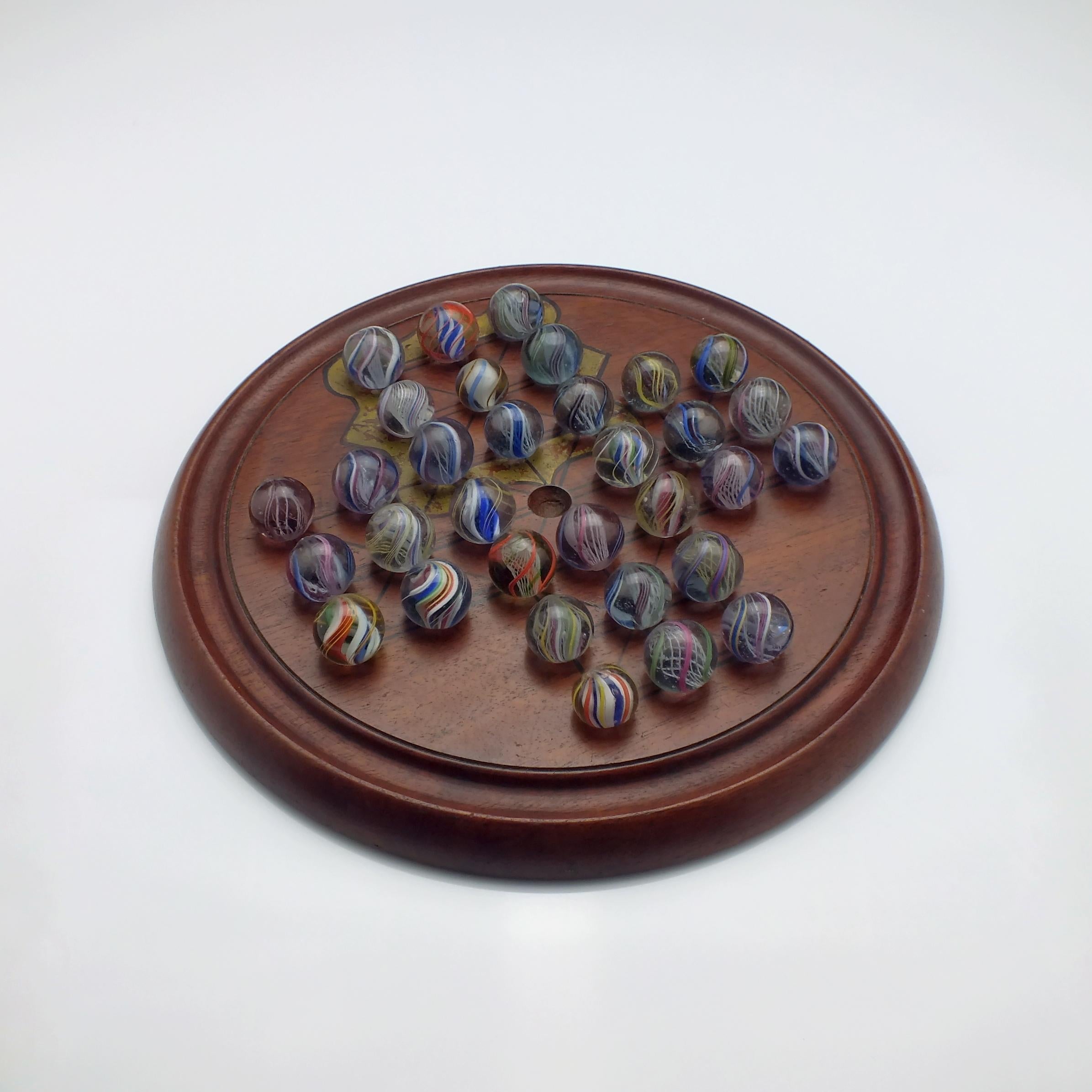 Date and origin 

Germany, circa 1870. Period of Wilhelm I.

Condition

Age-related wear, overall the set is in excellent condition, with ten marbles having a single or few very small nibbles. 

Dimensions: 

The board is 24.4cm in