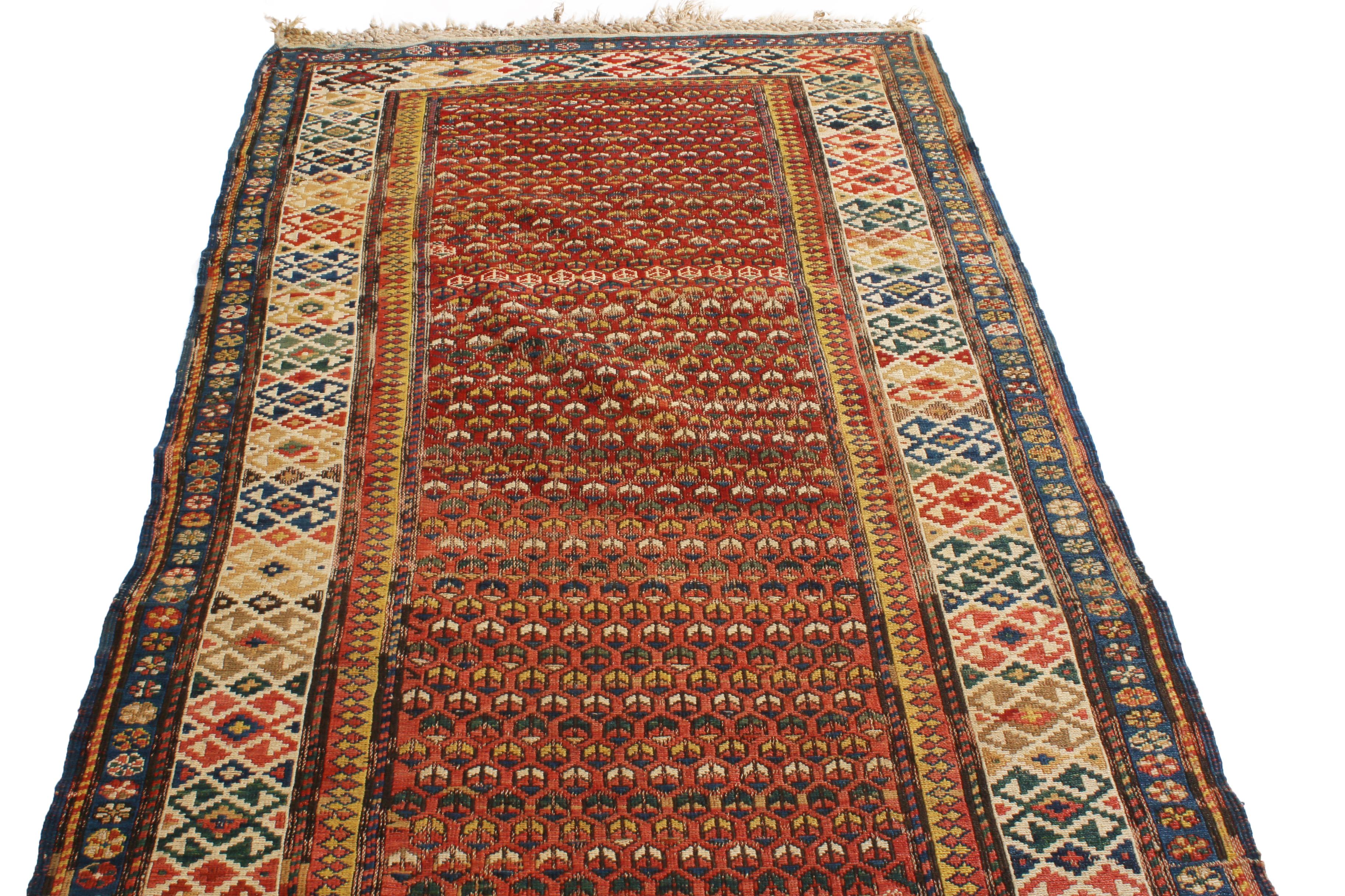 Hand knotted in high quality wool originating from Russia between 1890-1900, this bold antique Soumak rug hosts a distinguished array of traditionally rich and uncommonly spirited tribal colourways, balancing a repeated series of rustic burgundy and
