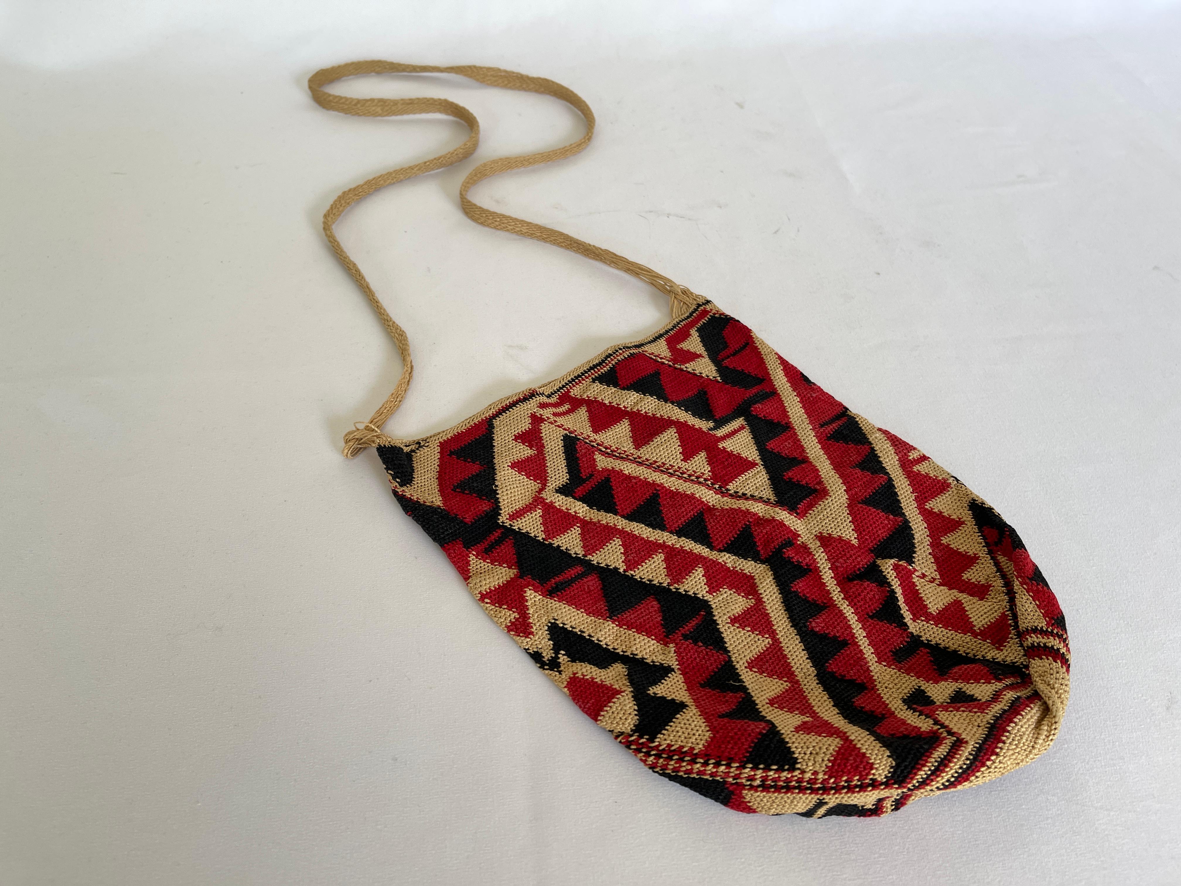 South American native geometric design sling bag with shoulder strap.
Finely woven with natural dyed and undyed natural cactus fiber. 
It has been stored impeccably over the years and is in superb condition/