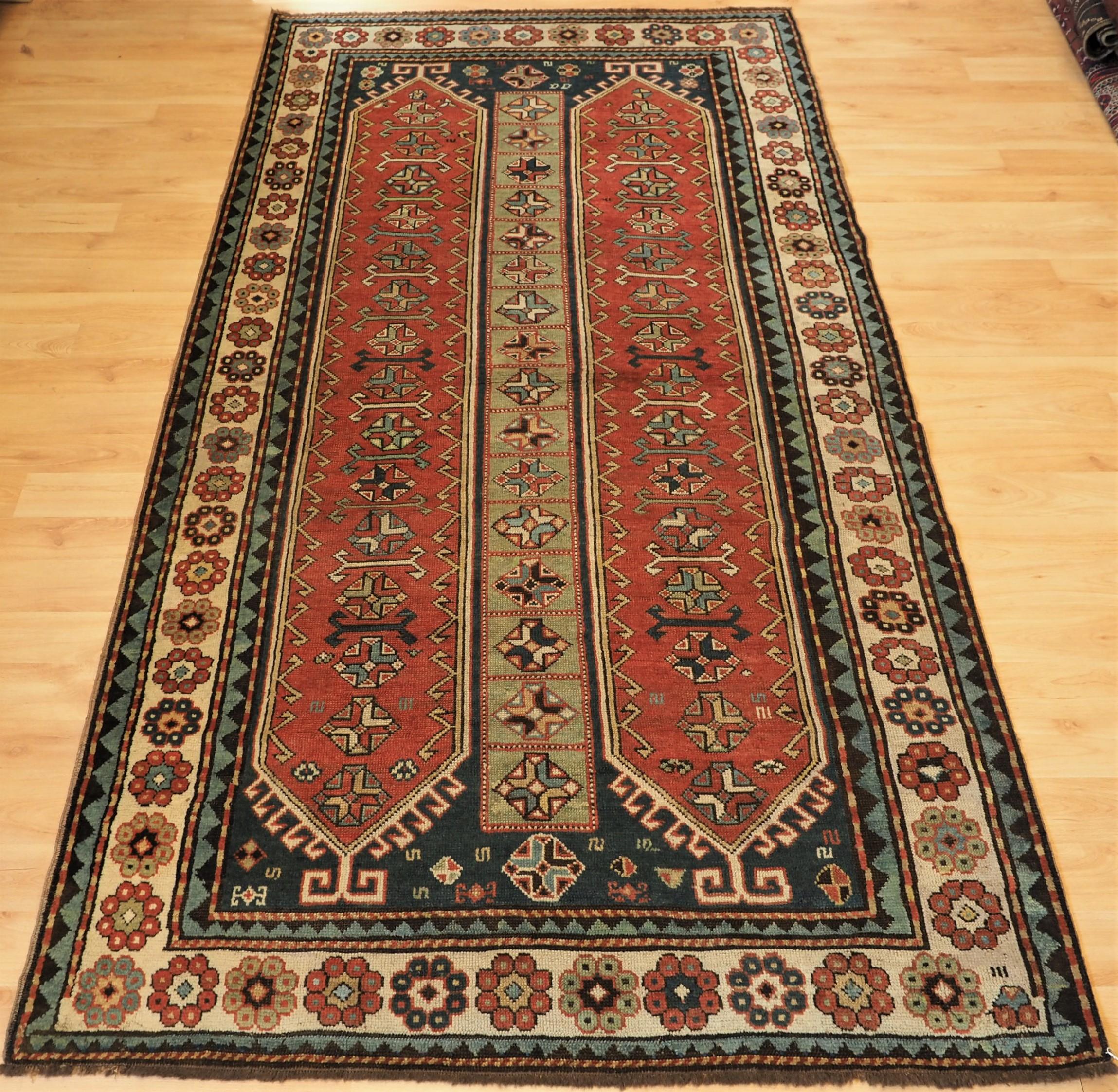 
Size: 8ft 6in x 4ft 6in (259 x 137cm).

Antique South Caucasian Kazak with two elongated latch hook medallions.

Circa 1890.

A superb example of a South Caucasian Kazak rug. Two long latch hook medallion in a soft terracotta on a dark indigo blue