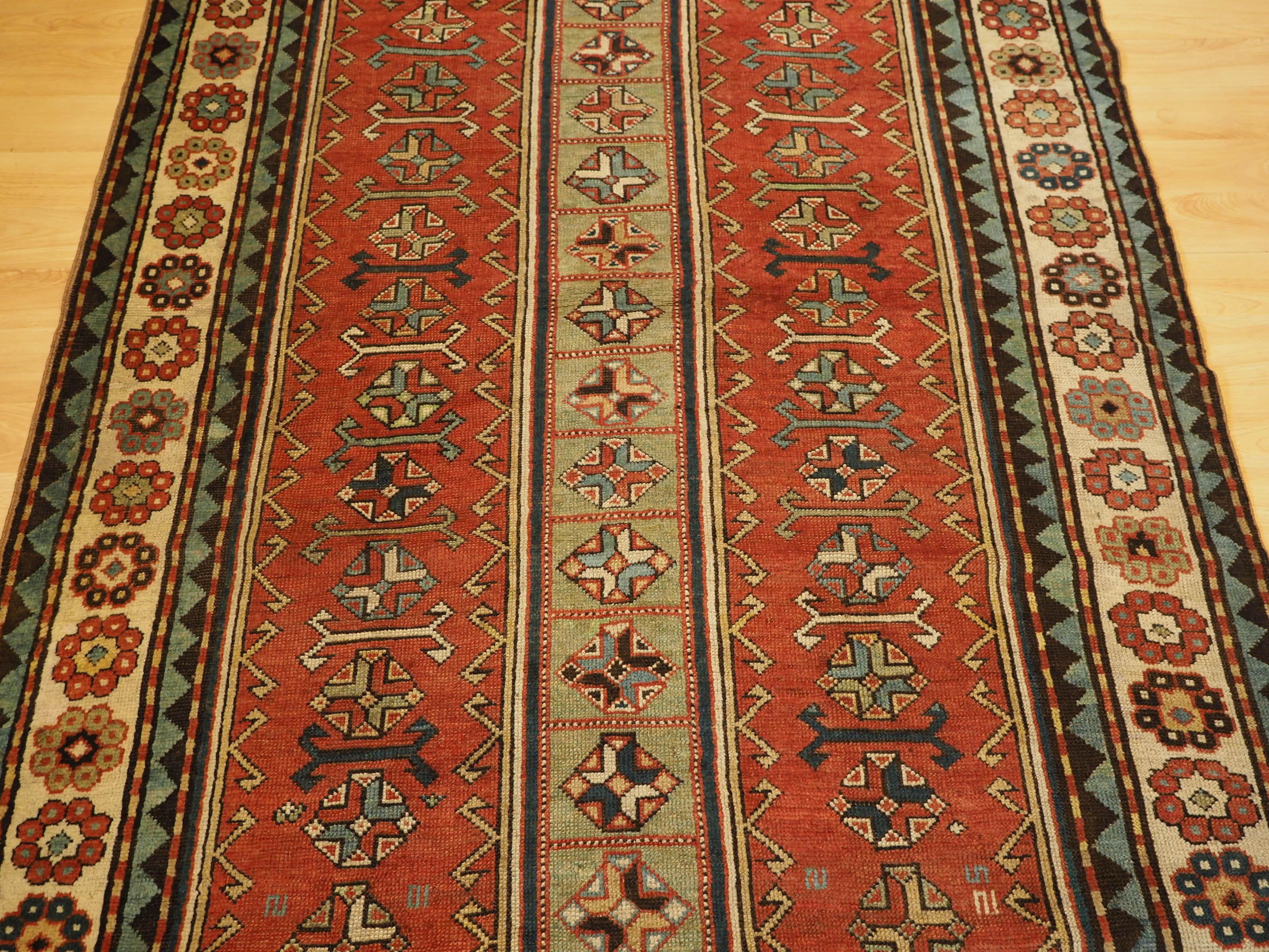 Antique South Caucasian Kazak with two elongated latch hook medallions. For Sale 1