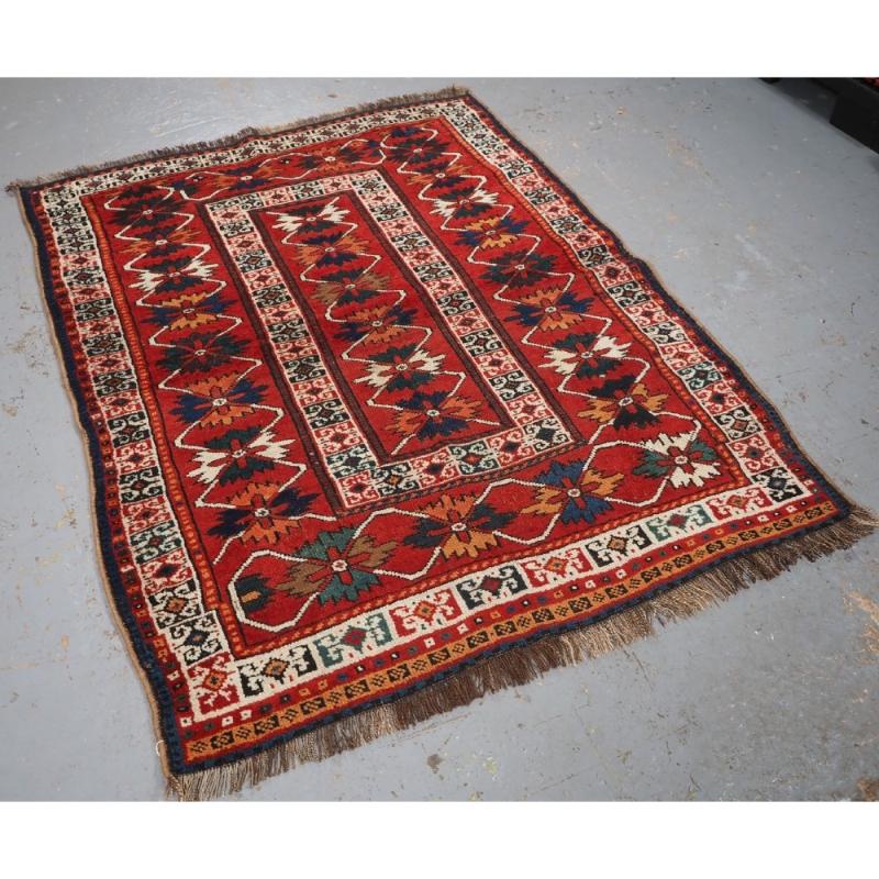 Antique South Caucasian Kurdish rug with colourful repeat design
Circa 1920

This is an interesting rug with a design to the field and borders that is associated with rugs from the Karabagh region of the south Caucasus The rug clearly has the weave