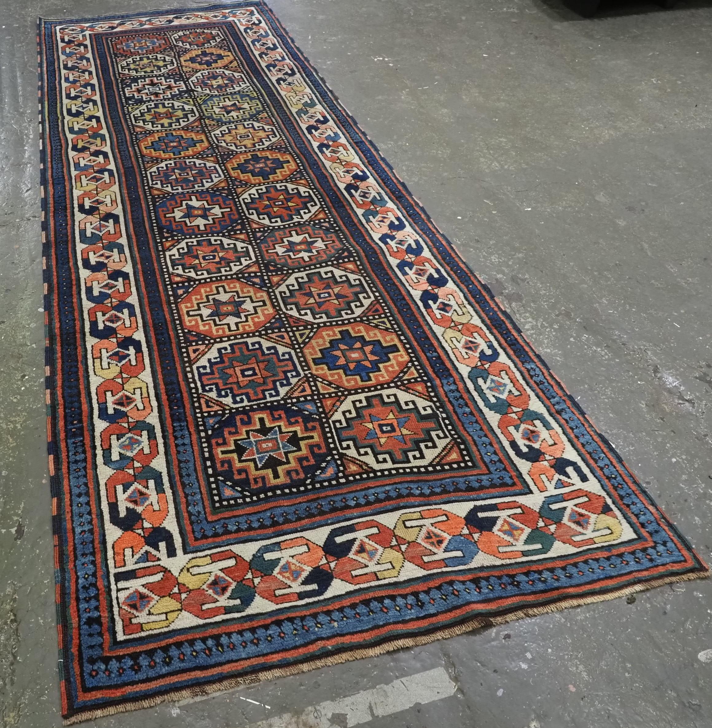 
Size: 11ft 3in x 4ft 0in (343 x 121cm)

Antique South Caucasian Moghan Kazak runner with Memling guls within octagons.

Circa 1890.

A superb Moghan Kazak runner with two vertical rows of 'Memling guls' within multi coloured octagons. The rug has a