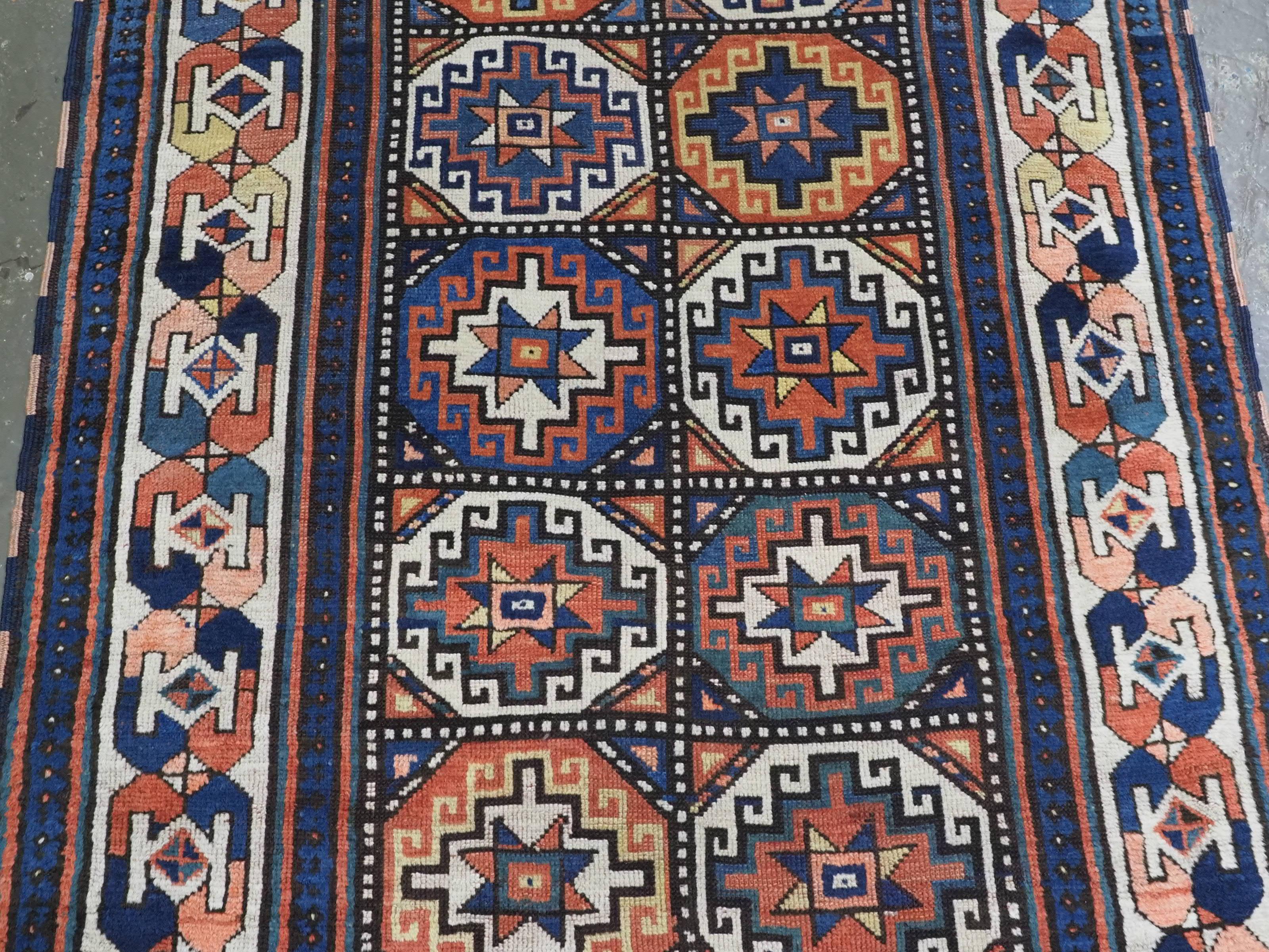 Wool Antique South Caucasian Moghan Kazak runner with Memling guls within octagons. For Sale