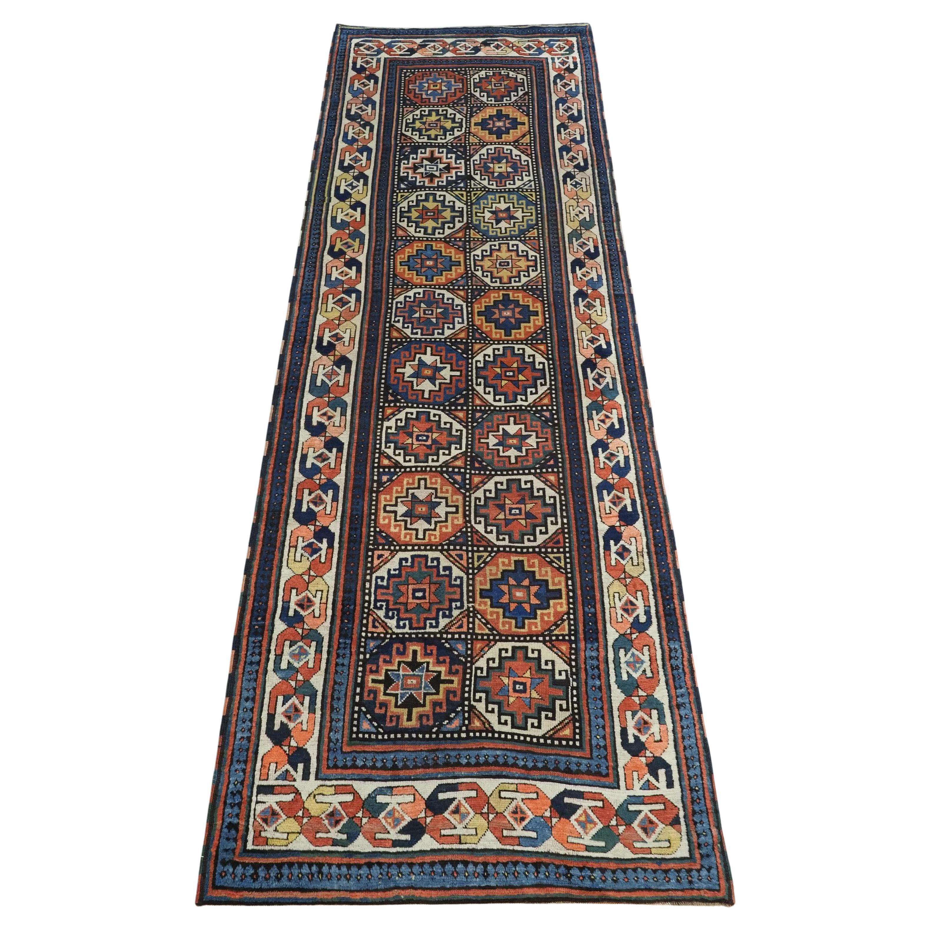 Antique South Caucasian Moghan Kazak runner with Memling guls within octagons. For Sale