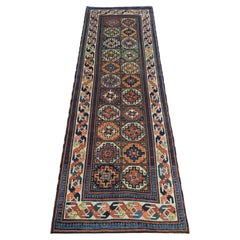 Antique South Caucasian Moghan Kazak runner with Memling guls within octagons.