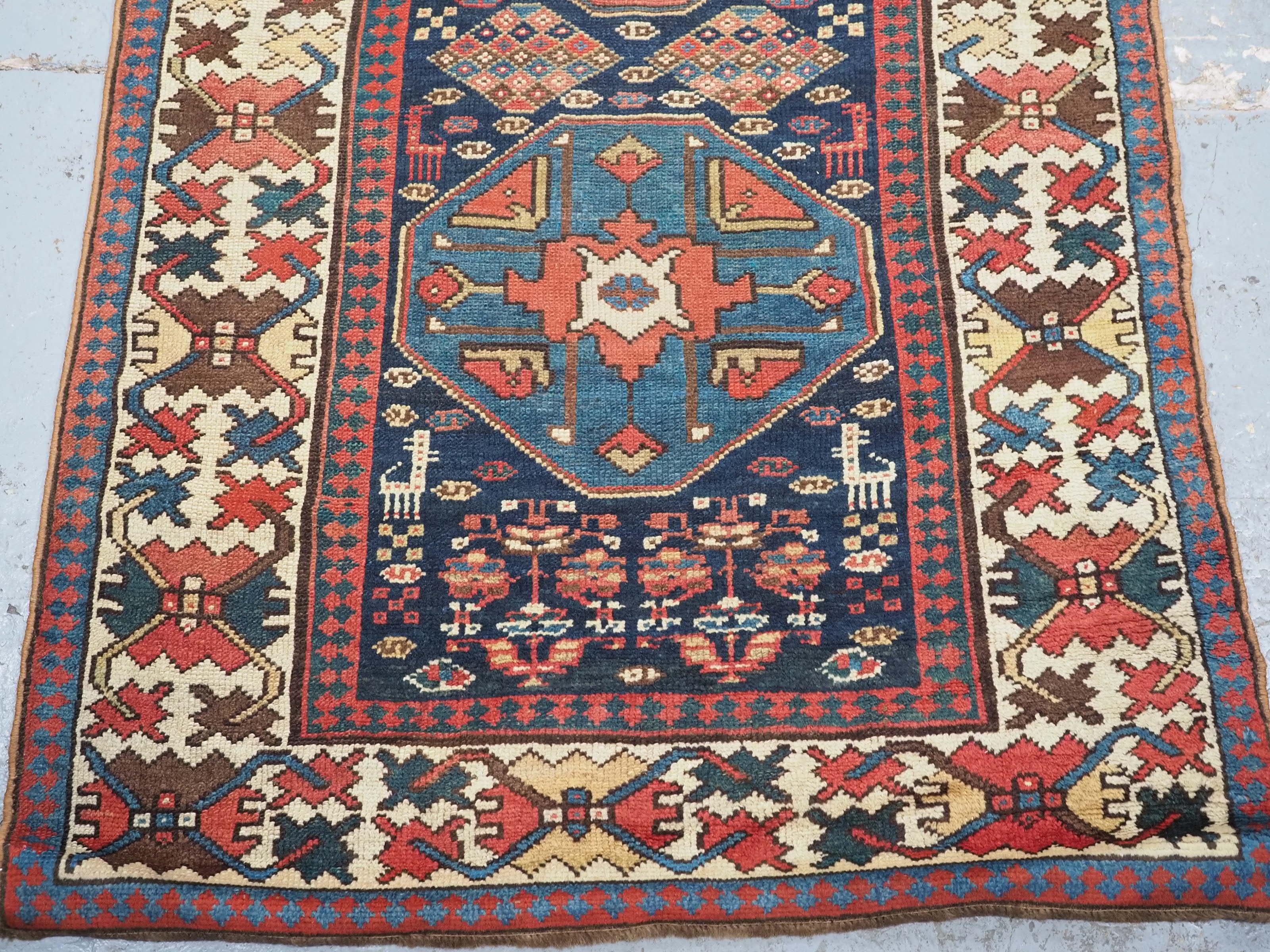 Wool Antique south Caucasian or Kurdish runner of superb design and colour. For Sale