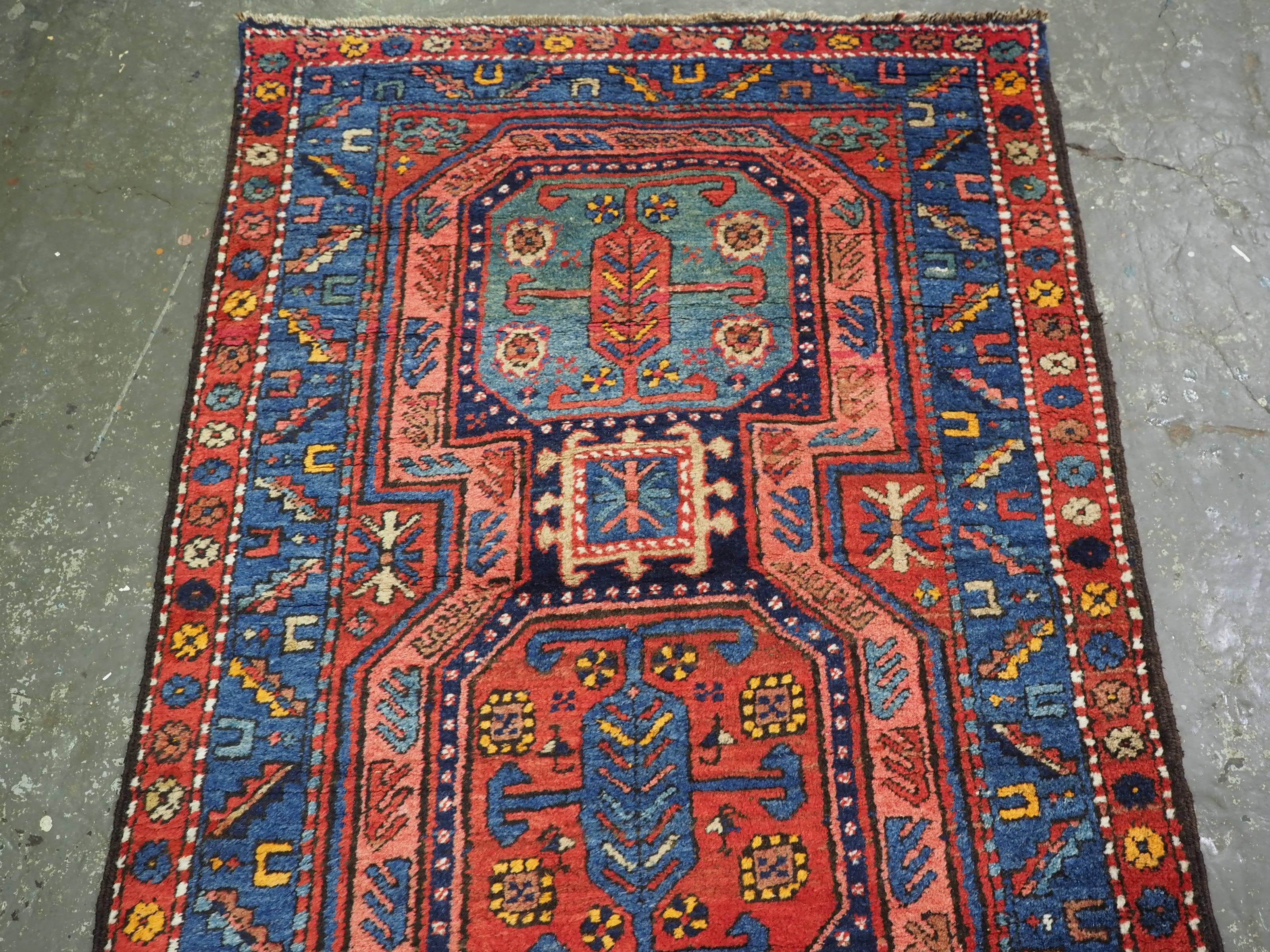 Size: 14ft 4in x 3ft 4in (438 x 102cm).

Antique South Caucasian or Kurdish runner of superb design and colour.

Circa 1920.

A very good runner with linked octagonal medallions, very similar in design to the well known Caucasian 'Surahani' garden