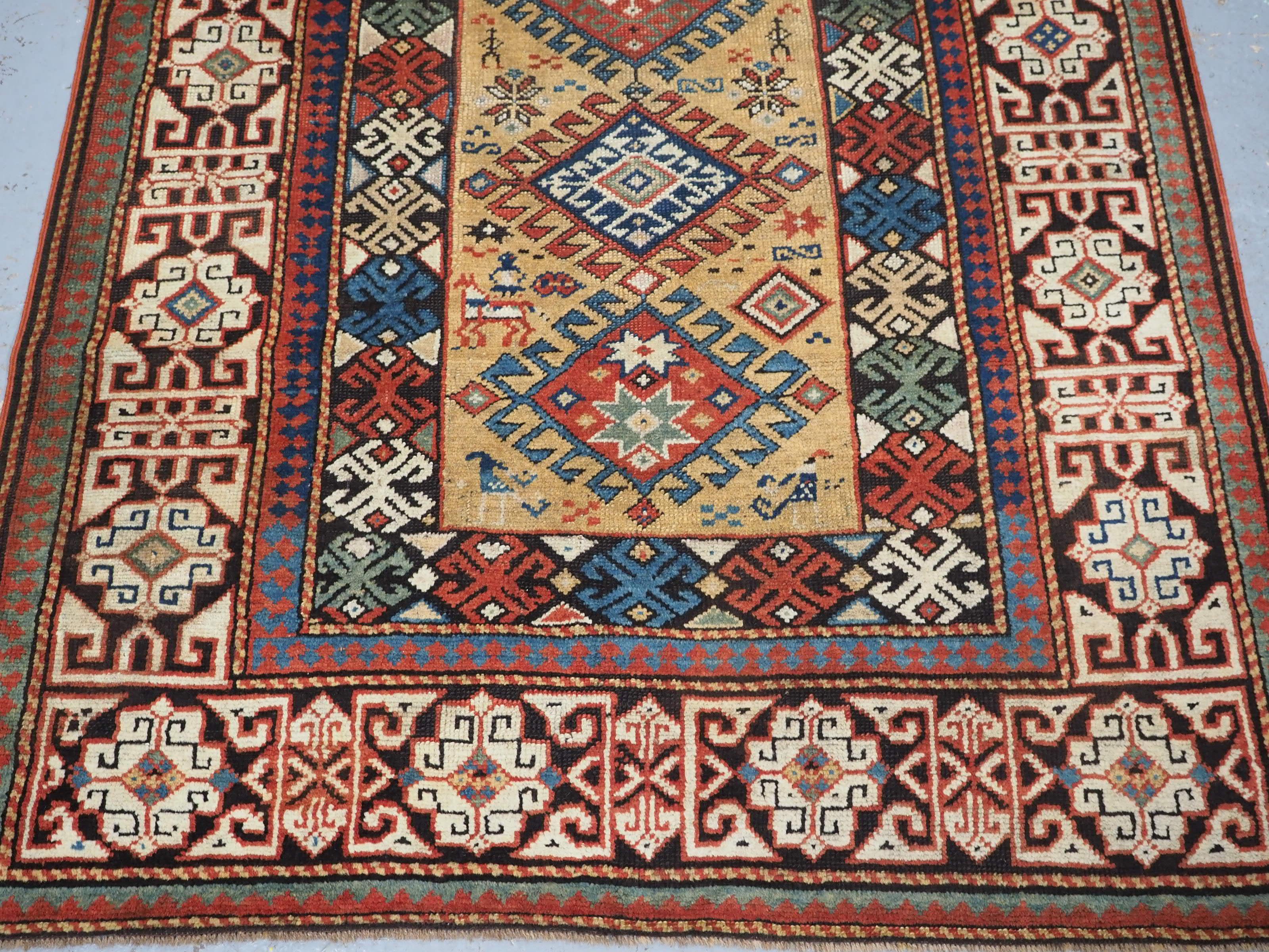 Wool Antique South Caucasian rug with scarce yellow ground.  Circa 1880. For Sale