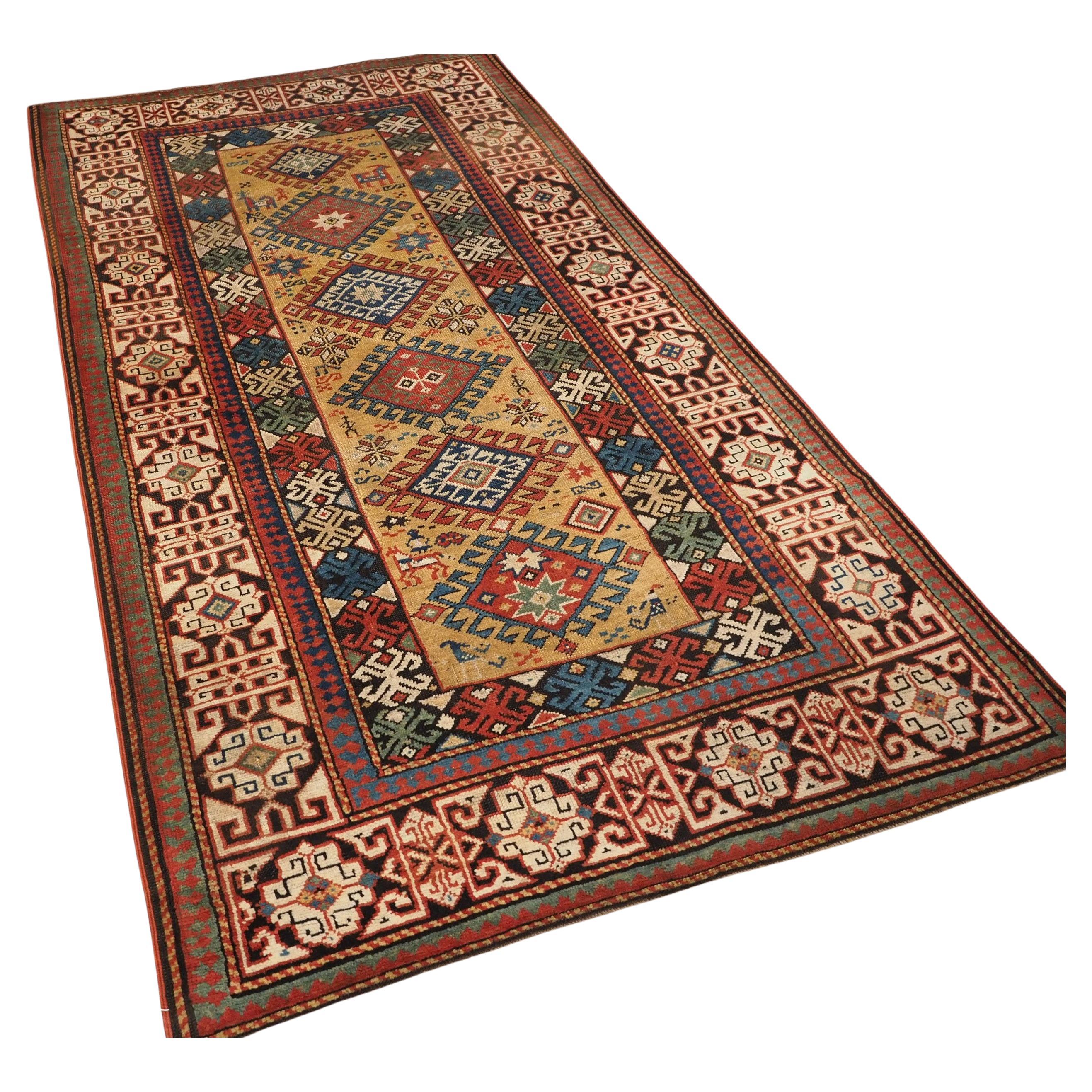Antique South Caucasian rug with scarce yellow ground.  Circa 1880.