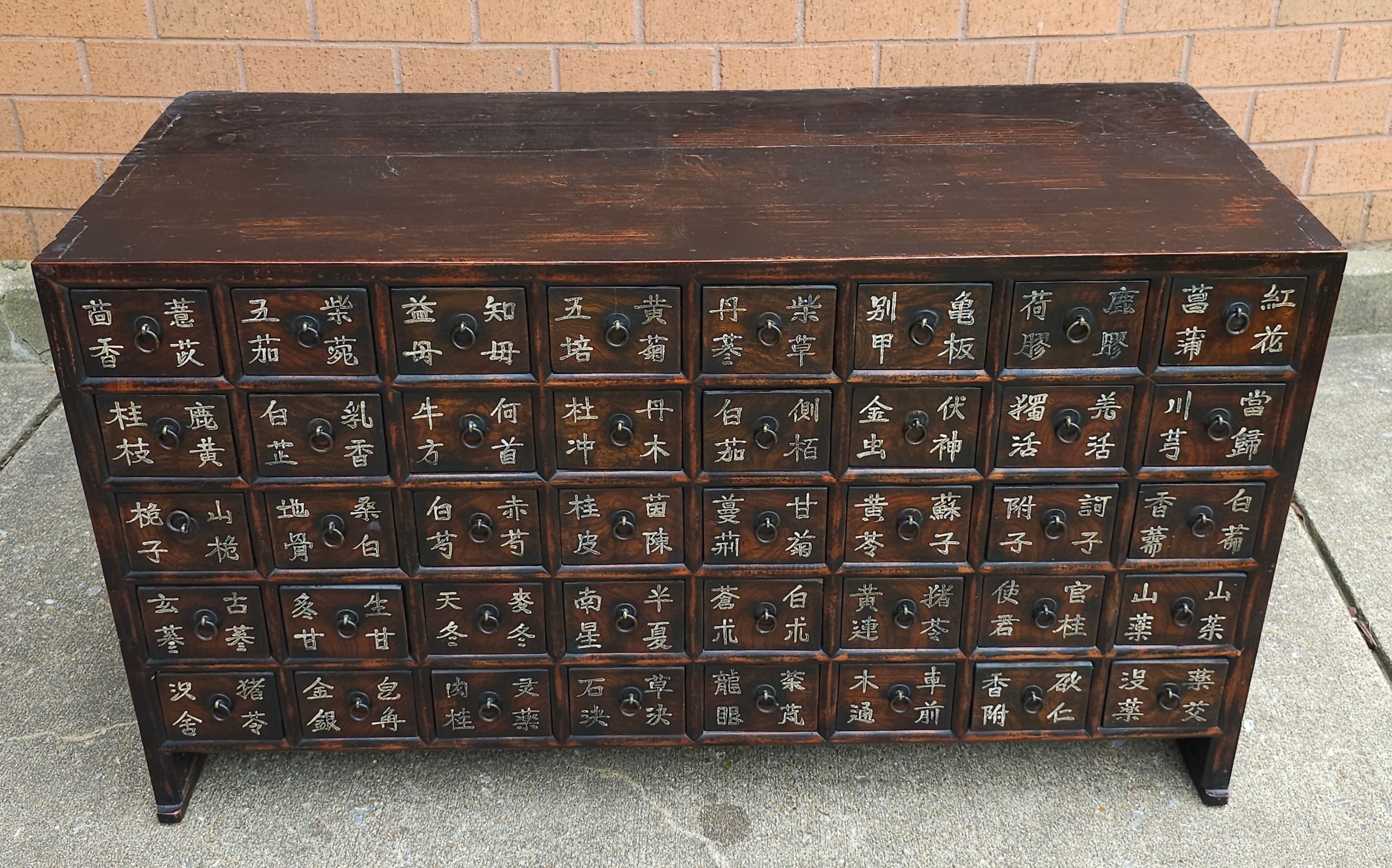 Antique Chinese 40-Drawer Apothecary Cabinet, Circa 1920s. All  drawers are divided in two. Drawers measure 2.75