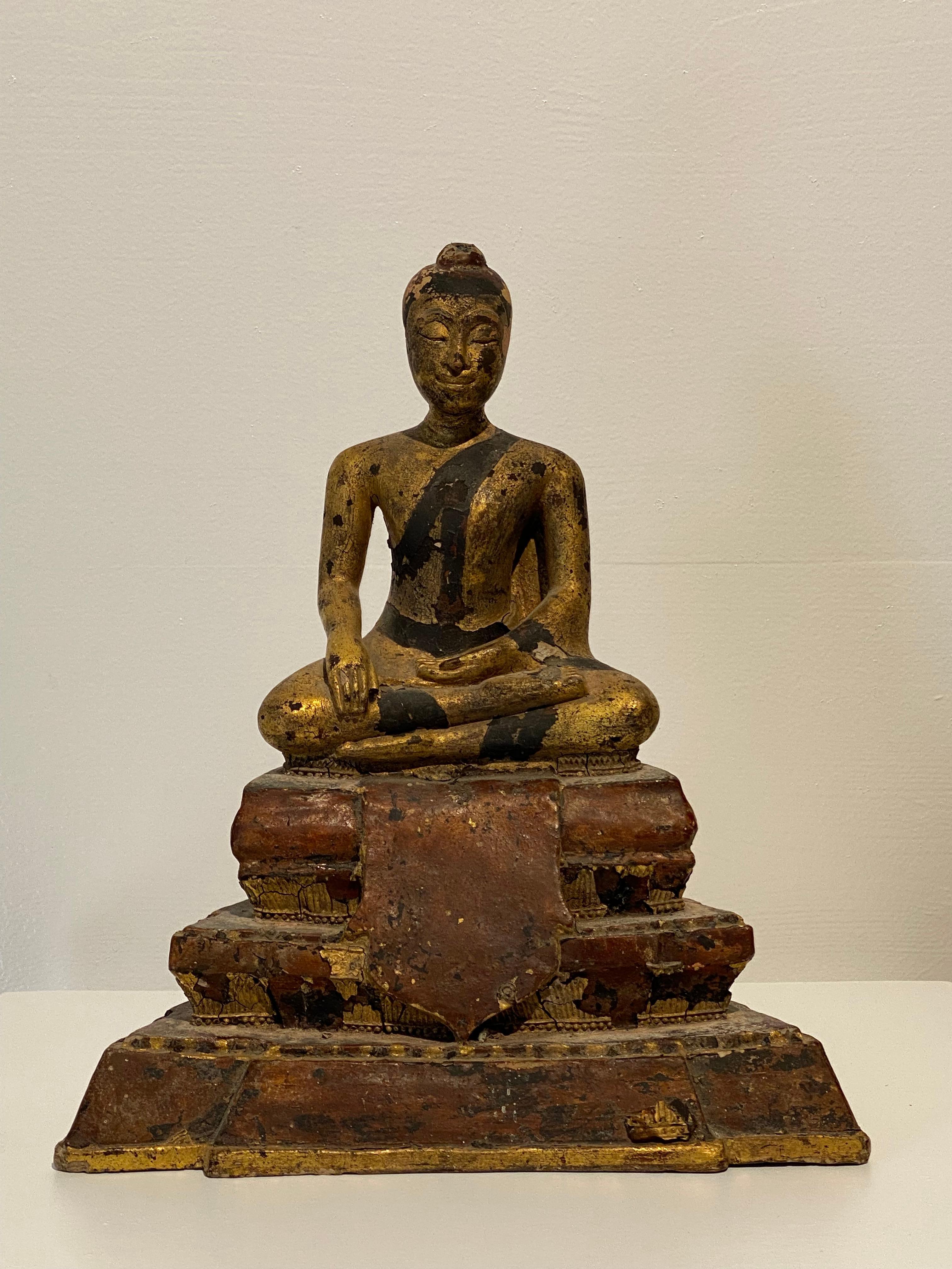Elegant and refined Terracotta sculpture of Buddha,
beautiful patina of the polychromed and gilded terracotta,
seated Buddha with very elegant and refined features,
a good quality of an Asian piece, very decorative and powerful object