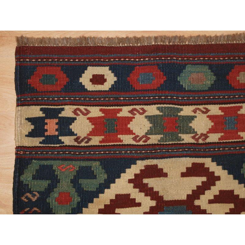 Antique South East Caucasian or Shahsavan mafrash end panel

Plain weave kilm with decorative embroidered designs to the field. Mafrash are bedding or storage bags used by the nomads, this panel is from the end of the bag. They make excellent