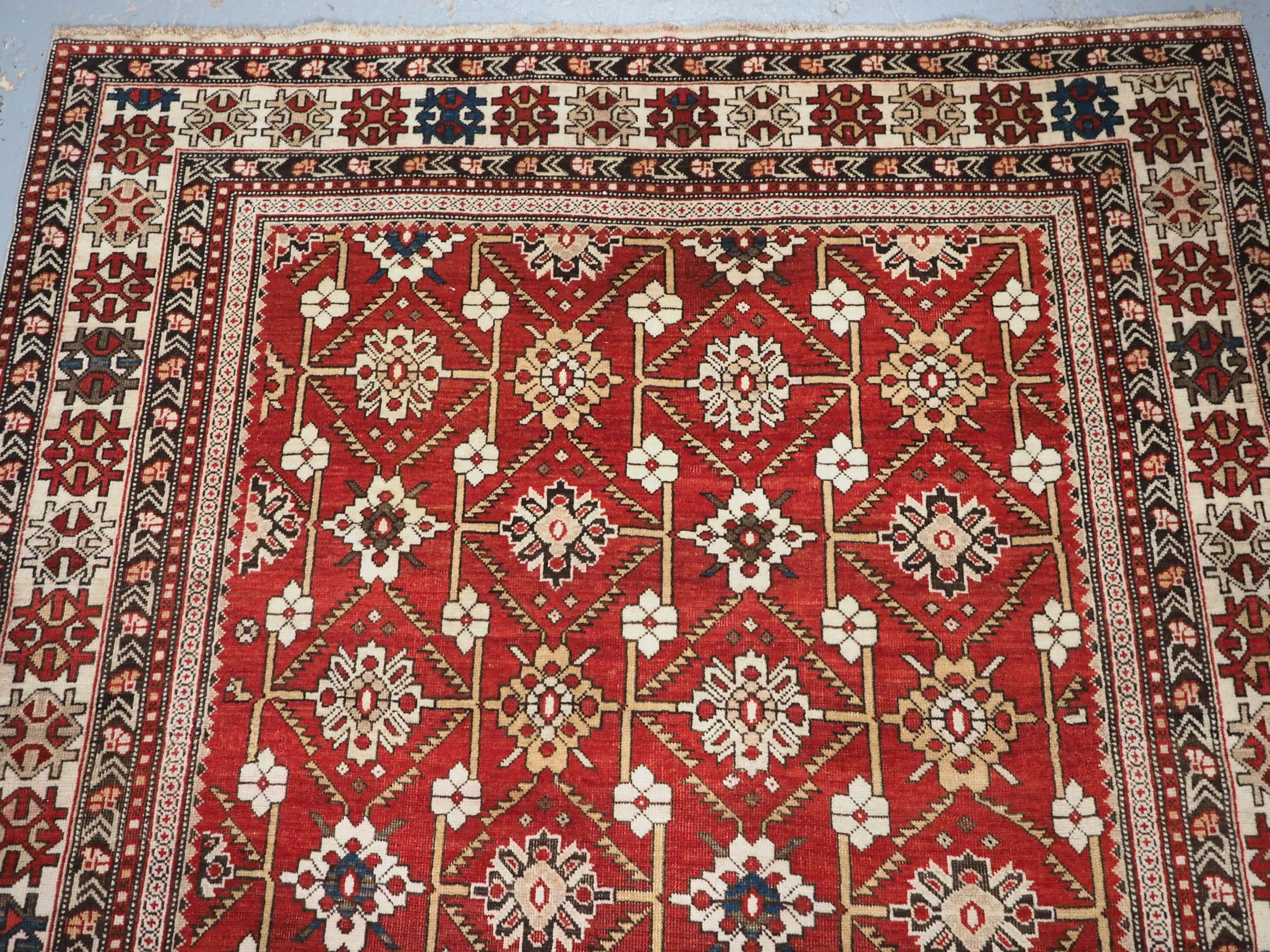 
Size: 5ft 1in x 4ft 8in (154 x 134cm).

Antique South East Caucasian Shirvan rug with bold floral lattice design.

Circa 1900.

This is a very good small Shirvan rug of almost square proportions, the design is one of the less common amongst Shirvan