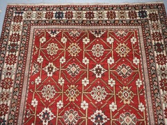 Antique South East Caucasian Shirvan rug with bold floral lattice design.