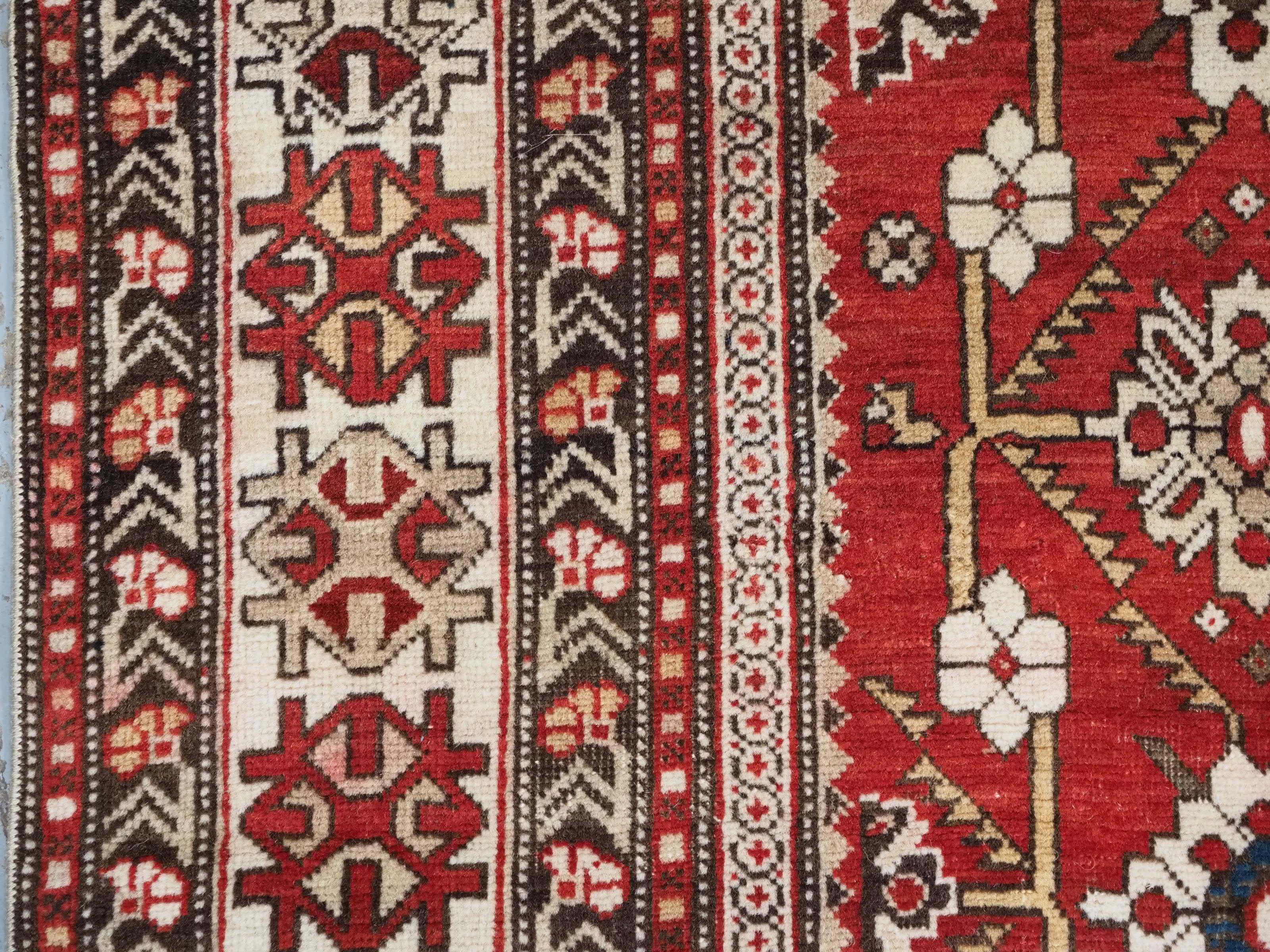 Antique South East Caucasian Shirvan rug with bold floral lattice design. For Sale 1